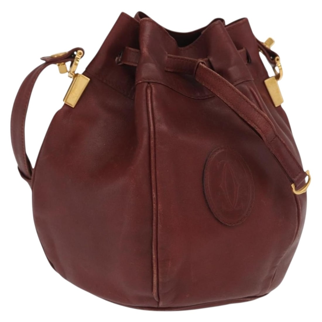 Cartier Must Line Bordeaux Leather Shoulder Bag Gold Accent Spain: Cartier Must Line Bordeaux Leather Shoulder Bag Gold Accent Spain This Cartier Must Line shoulder bag is crafted from leather in a Bordeaux and gold color combination. Made in Spain, it features a str