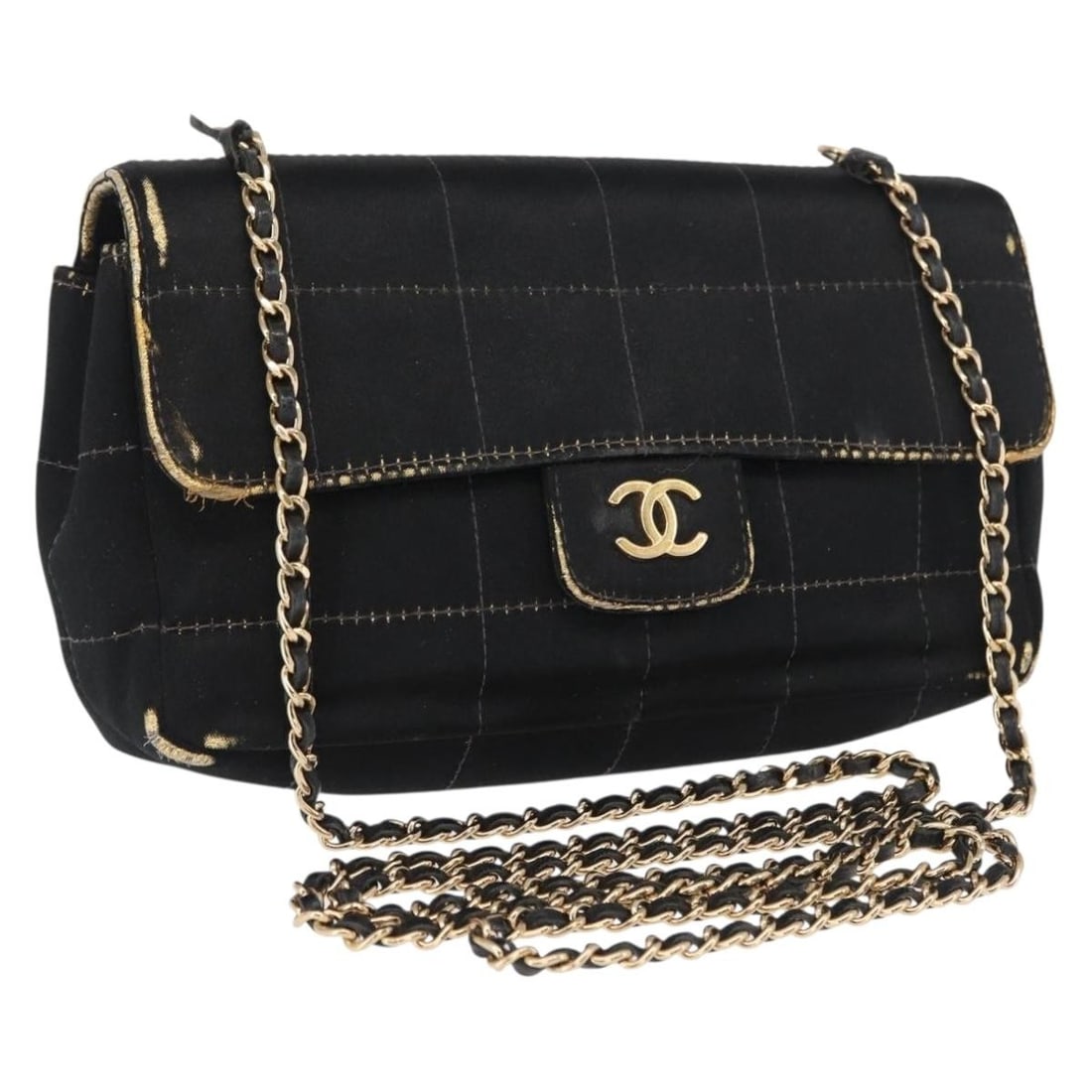 Black Satin Choco Bar Shoulder Bag by CHANEL with Gold Tone CC Logo: Black Satin Choco Bar Shoulder Bag by CHANEL with Gold Tone CC Logo This CHANEL Choco Bar Chain Shoulder Bag features a black and gold satin exterior with a signature gold CC accent. The bag is design