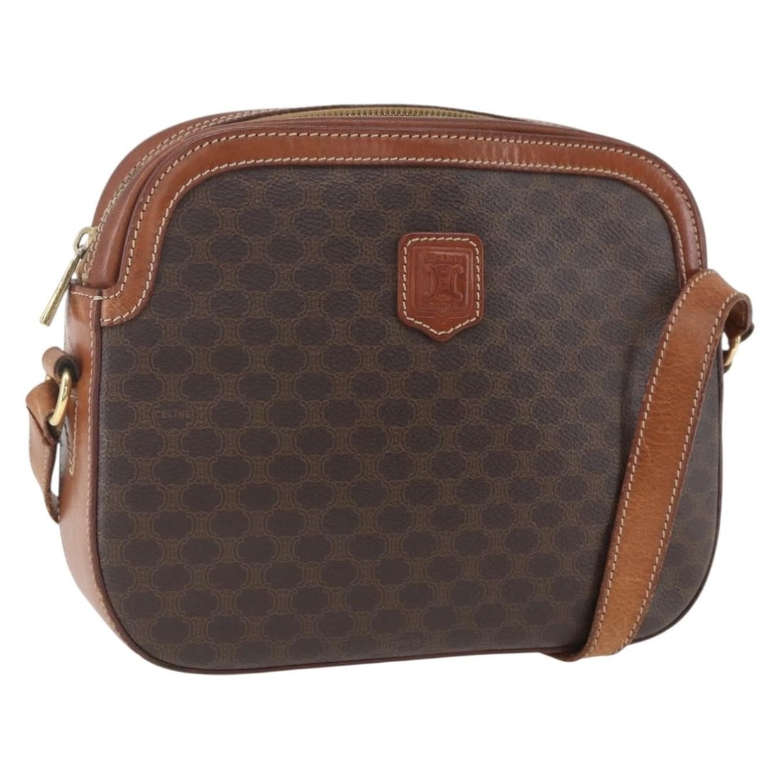 Celine Macadam Shoulder Bag Brown PVC Leather Gold Accents Italy: Celine Macadam Shoulder Bag Brown PVC Leather Gold Accents Italy This CELINE shoulder bag features the iconic Macadam canvas with PVC leather accents in brown and gold tones. Crafted in Italy, it offe