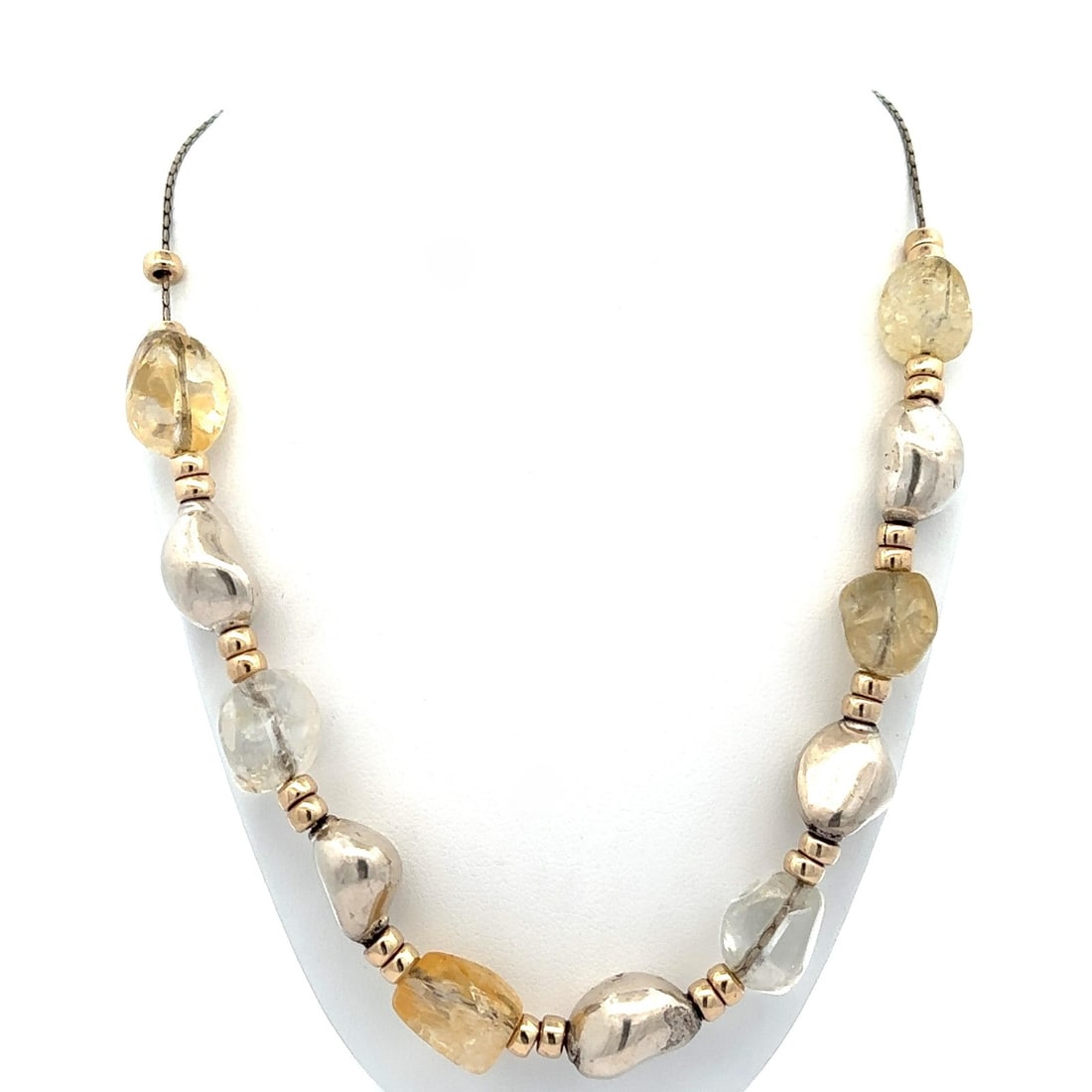 Sterling Silver Necklace with Natural Freeform Citrine Beads: Sterling Silver Necklace with Natural Freeform Citrine Beads This exquisite necklace features a stunning design with natural genuine citrine beads, beautifully carved in a freeform style. The necklace