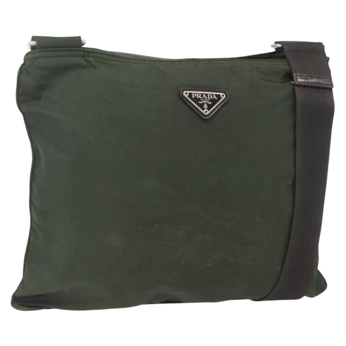 Prada Khaki Nylon Shoulder Bag with Silver Accents Made in Italy: Prada Khaki Nylon Shoulder Bag with Silver Accents Made in Italy This PRADA shoulder bag features a khaki and silver nylon exterior and was made in Italy. The bag has a practical design with an adjust