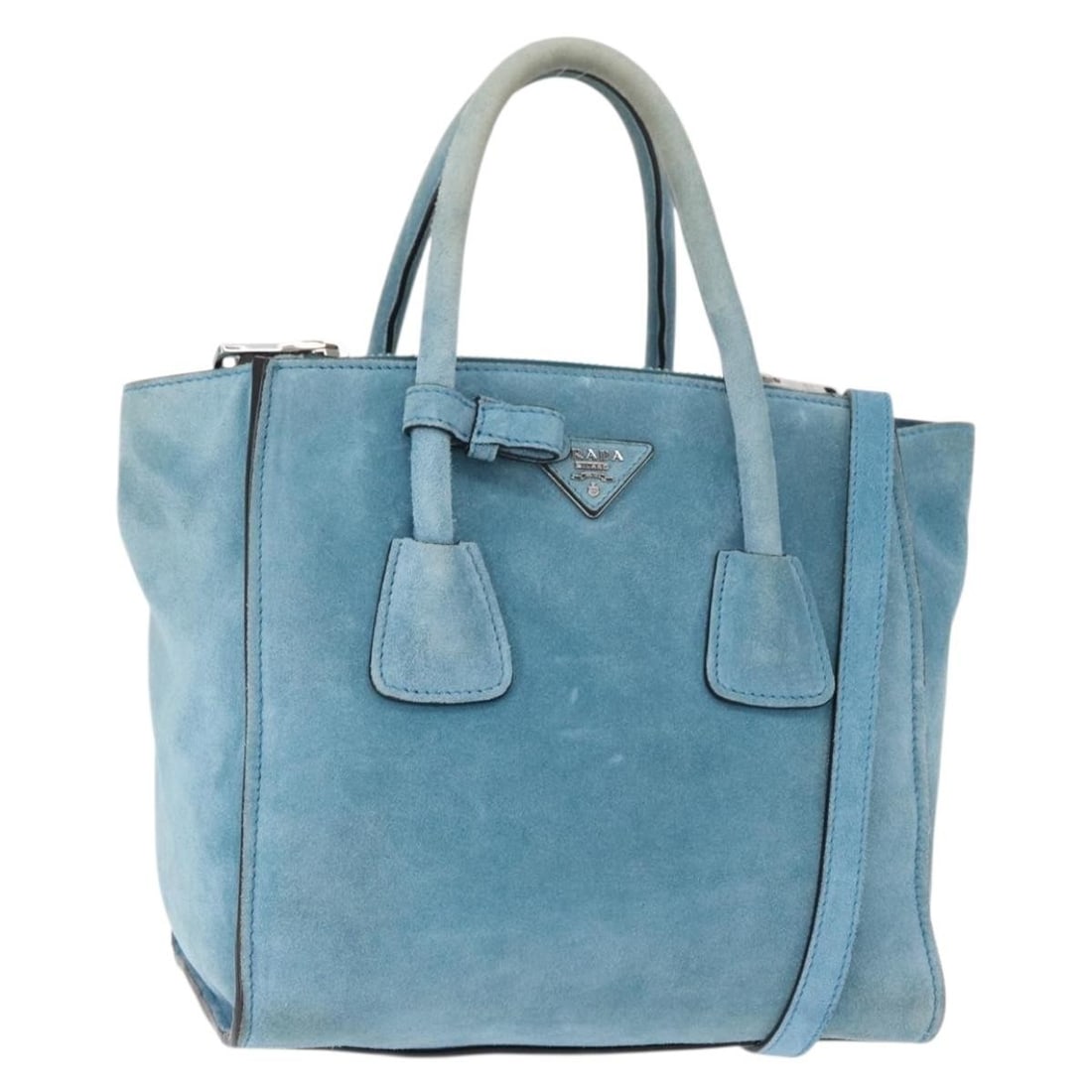 PRADA BN2625 Turquoise Blue Suede Hand Bag with Silver Accents: PRADA BN2625 Turquoise Blue Suede Hand Bag with Silver Accents This authentic PRADA hand bag is crafted from luxurious suede in a stunning turquoise blue and silver color combination. Designed both fo