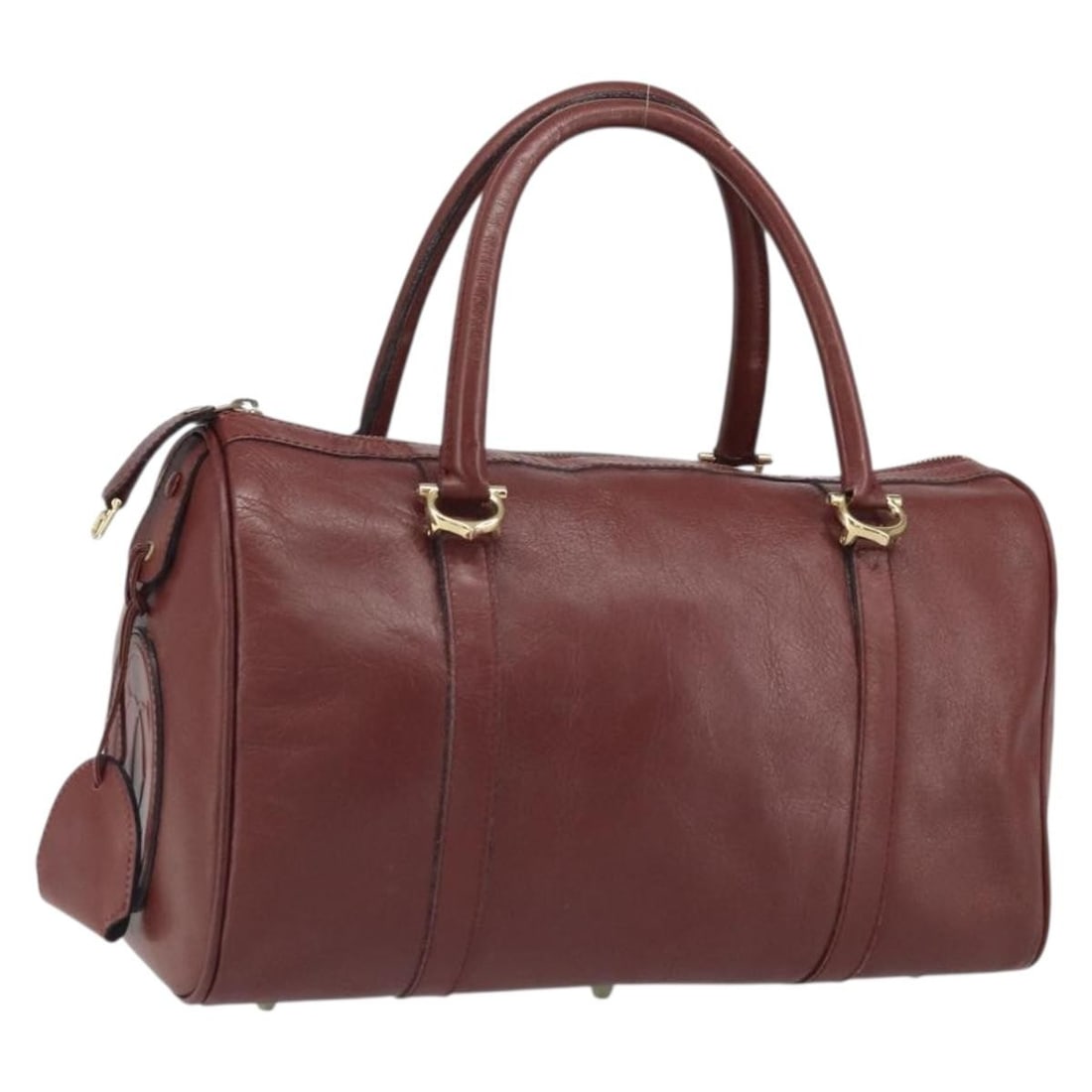 Cartier Must Line Bordeaux Leather Handbag with Gold-Tone Accents and Keys: Cartier Must Line Bordeaux Leather Handbag with Gold-Tone Accents and Keys This is a Cartier Must Line handbag crafted from leather in a Bordeaux color with gold-tone accents. The bag features a class