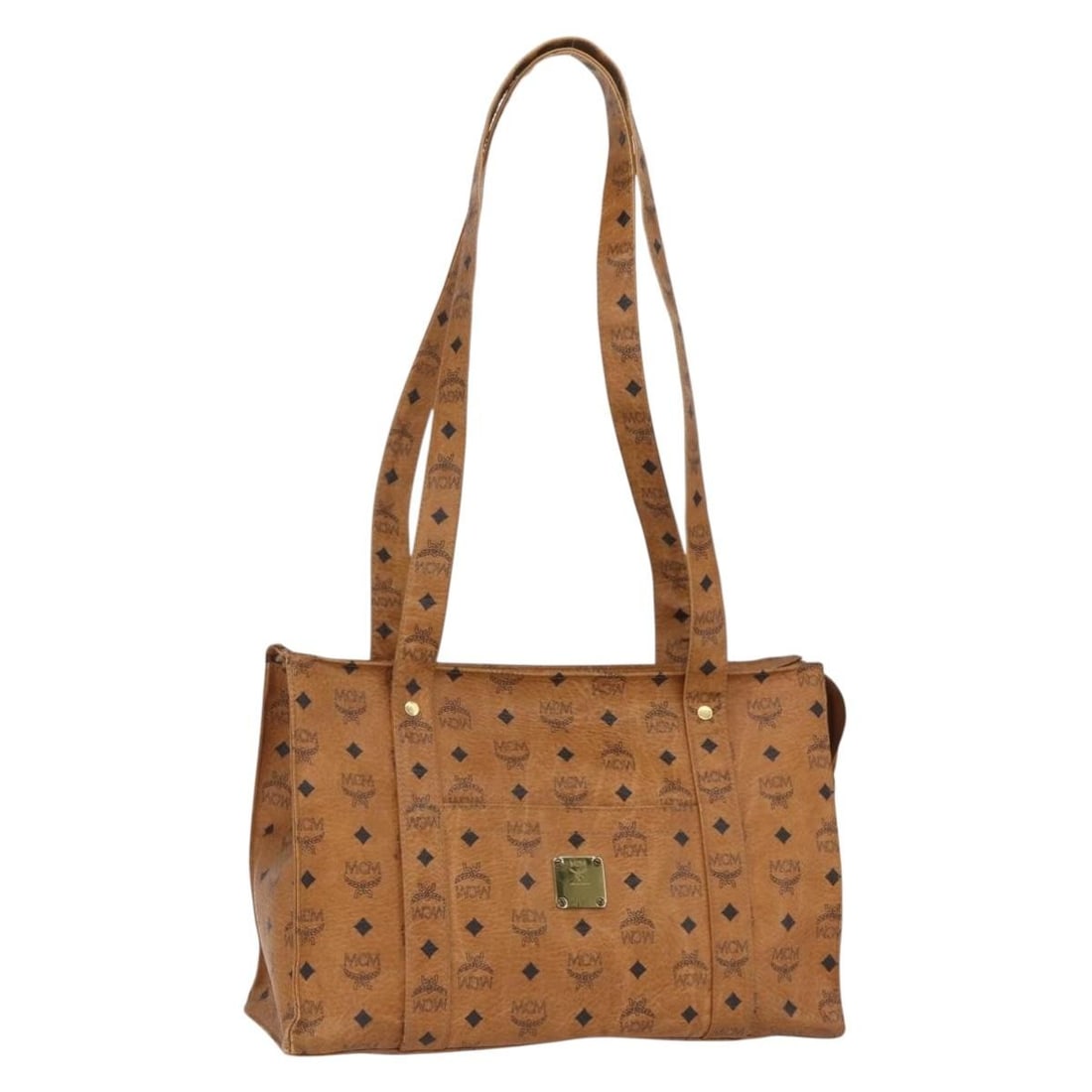 Brown PVC MCM Vicetos Tote Bag with Gold Accents from Germany: Brown PVC MCM Vicetos Tote Bag with Gold Accents from Germany This MCM Logogram Vicetos tote bag is crafted from brown and gold PVC leather. The bag features dual top handles with a drop of approximat