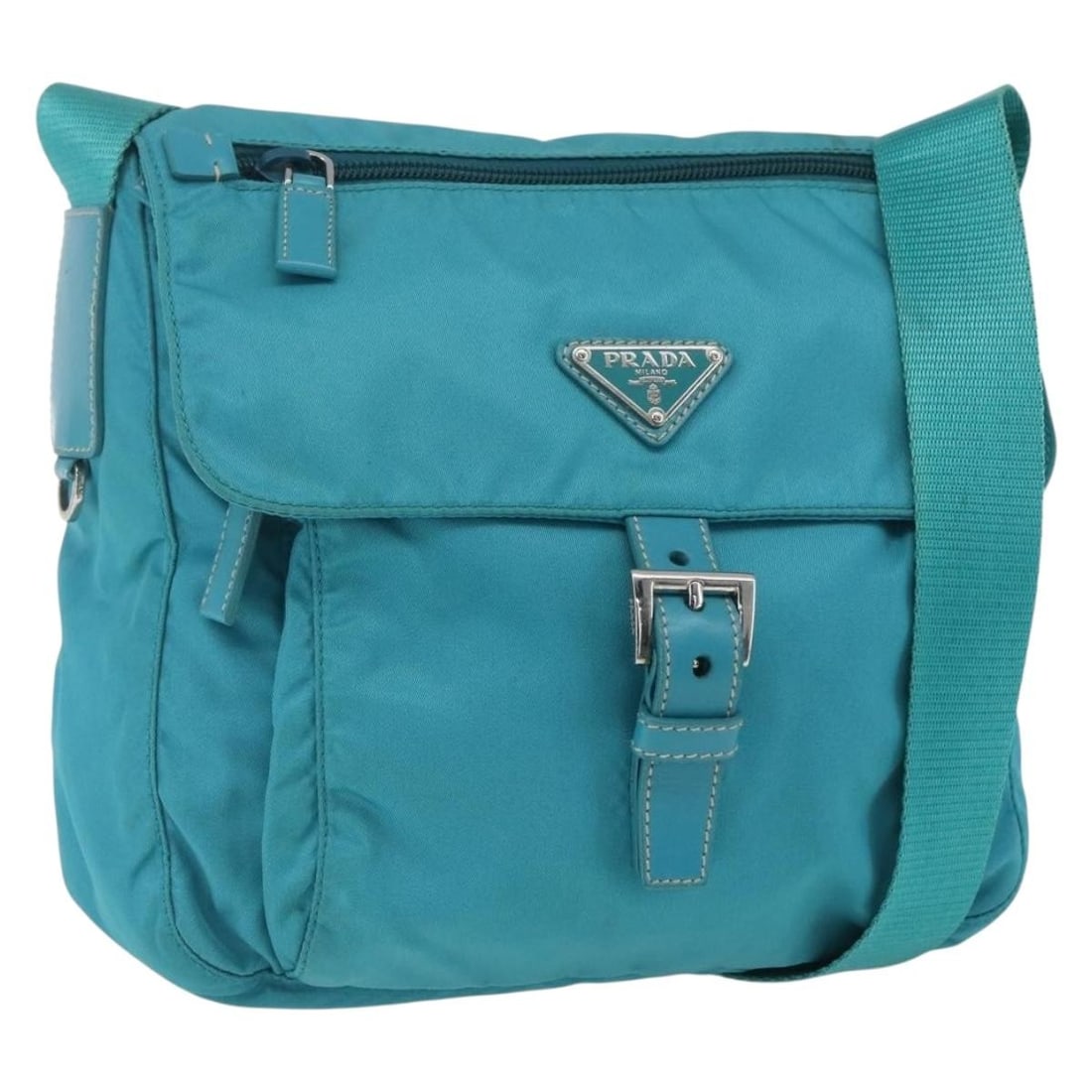 Light Blue Nylon Shoulder Purse by PRADA with Silver Accents: Light Blue Nylon Shoulder Purse by PRADA with Silver Accents This PRADA shoulder bag features a light blue nylon exterior with silver accents. Made in Italy, the bag offers a spacious interior and an