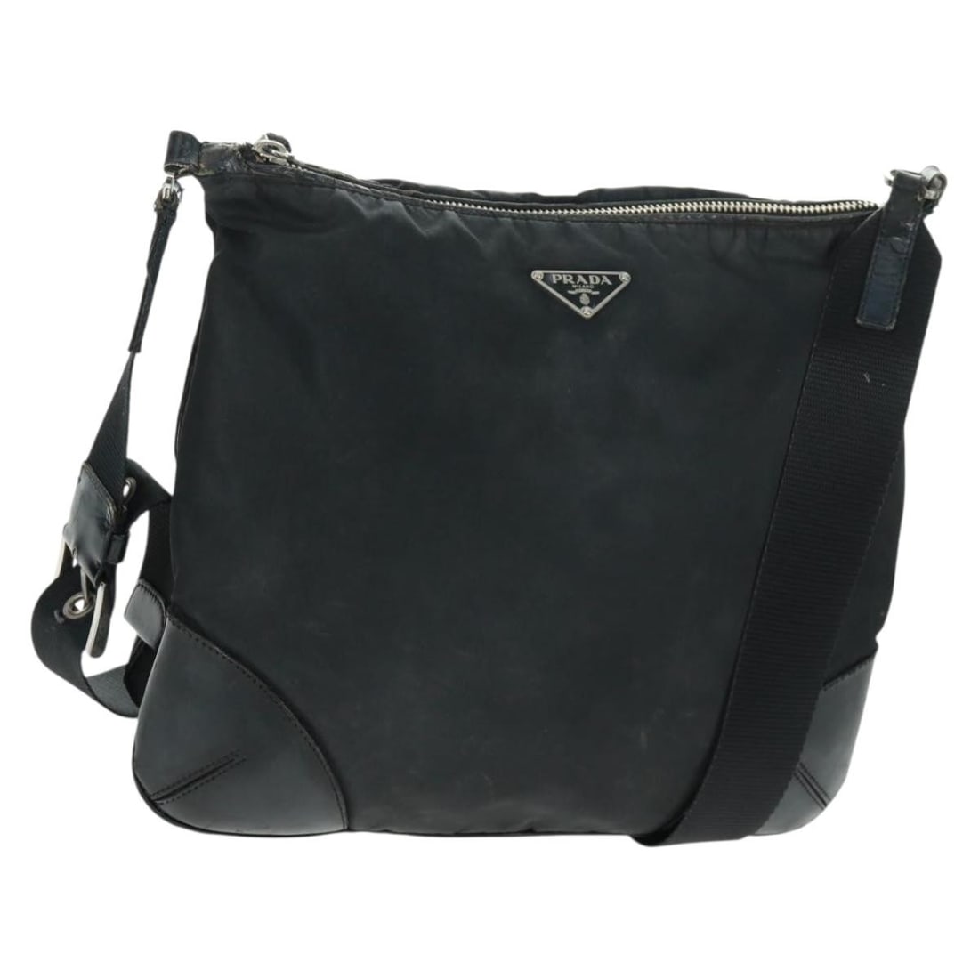 Prada Black Nylon and Leather Shoulder Bag with Silver Accents: Prada Black Nylon and Leather Shoulder Bag with Silver Accents This PRADA shoulder bag is crafted from black nylon with leather accents and silver-tone hardware. Made in Italy, it features a spacious