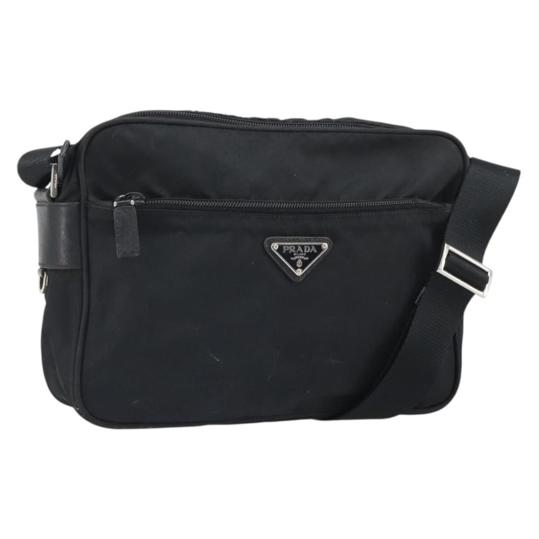 Prada Black Nylon Shoulder Bag with Silver Tone Accents Italy: Prada Black Nylon Shoulder Bag with Silver Tone Accents Italy This PRADA shoulder bag is crafted from black nylon with silver-tone accents. Made in Italy, it features a spacious interior and an adjust
