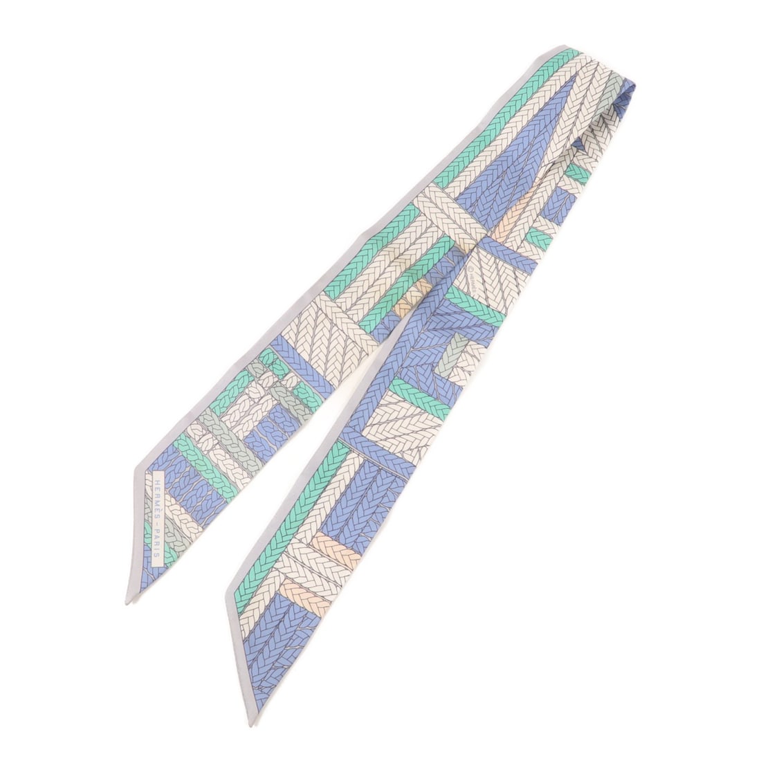 HERMES Multicolor Silk Twilly Scarf Made in France: HERMES Multicolor Silk Twilly Scarf Made in France This exquisite HERMES Twilly Scarf is crafted from luxurious silk, showcasing a vibrant multicolor design that adds a touch of elegance to any outfit