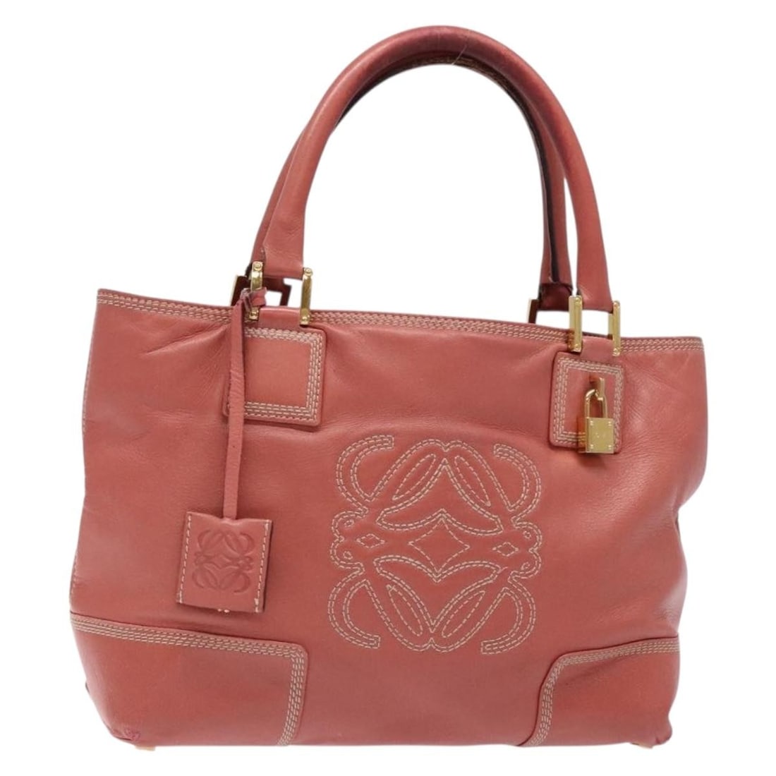 LOEWE Pink Gold Anagram Leather Hand Bag Made in Spain: LOEWE Pink Gold Anagram Leather Hand Bag Made in Spain Introducing the LOEWE Anagram Hand Bag, a beautifully crafted leather handbag in an eye-catching pink and gold color scheme. This stylish piece f