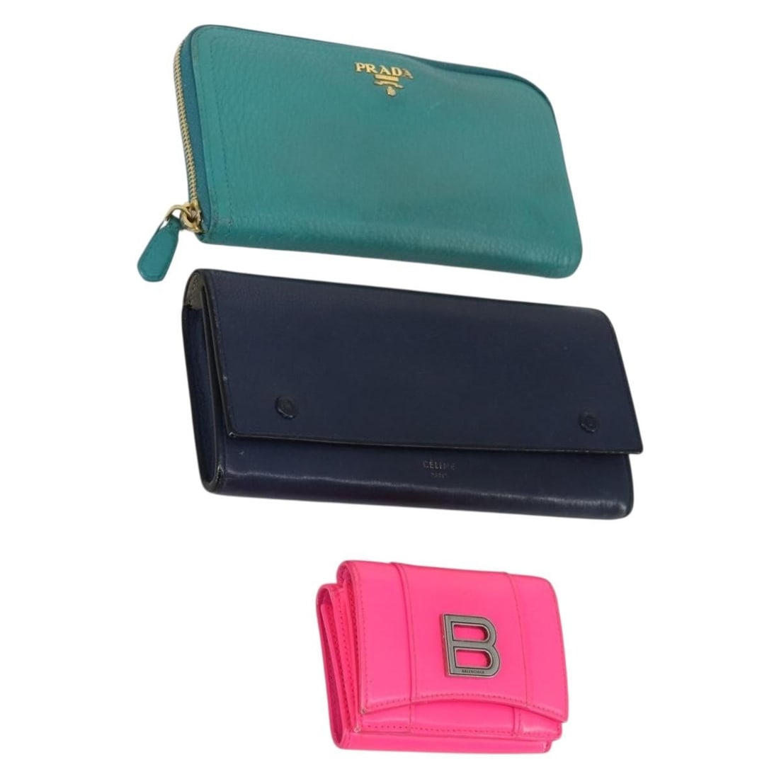Balenciaga Leather Wallet Trio in Green Pink and Navy: Balenciaga Leather Wallet Trio in Green Pink and Navy This is a set of three leather wallets in green, pink, and navy. The set includes items from BALENCIAGA, Prada, and Celine. Each wallet shows sign