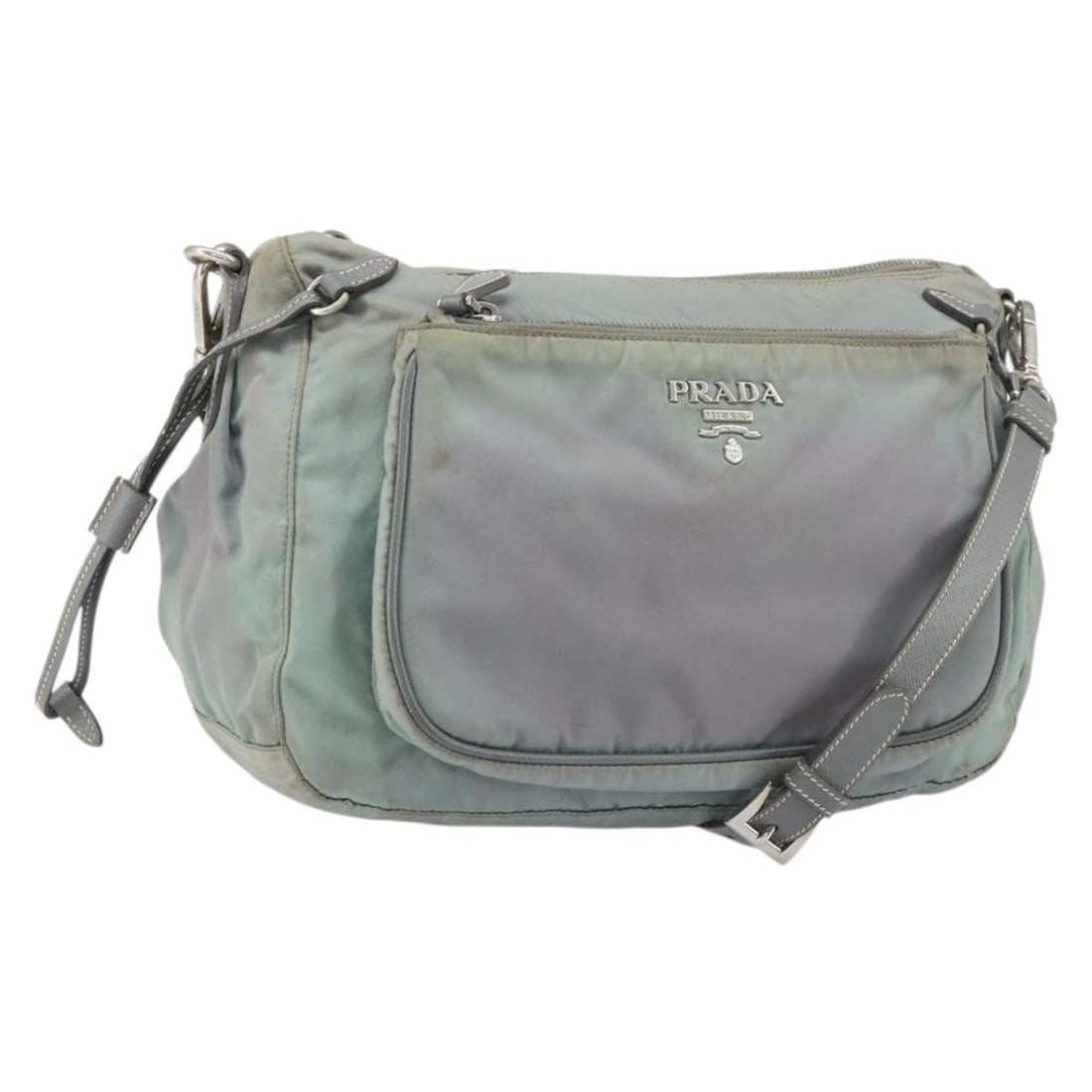 Prada Gray Nylon Shoulder Bag Silver Tone Hardware Italy: Prada Gray Nylon Shoulder Bag Silver Tone Hardware Italy This PRADA shoulder bag is crafted from gray and silver nylon and features a practical design with an adjustable strap. Made in Italy, the bag
