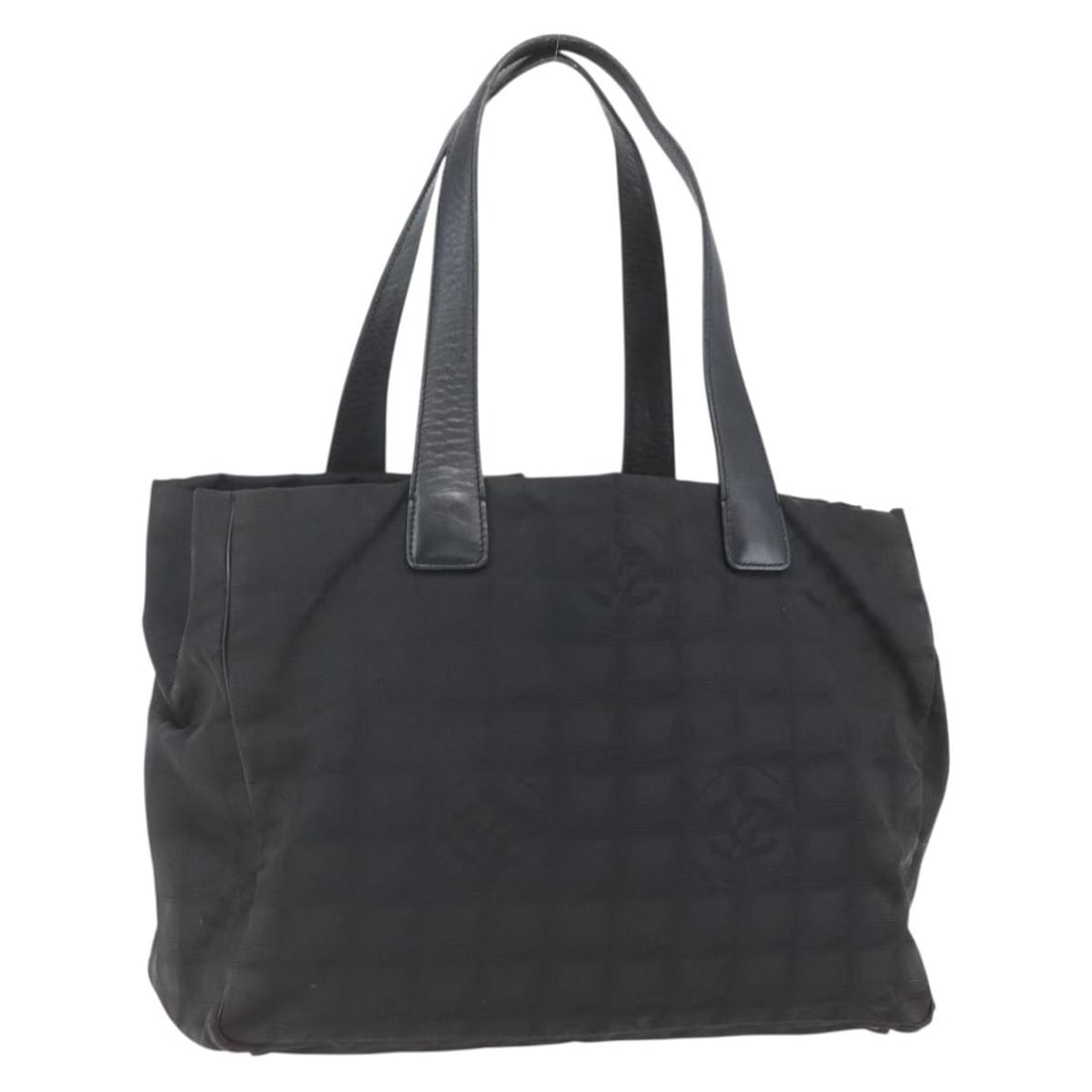 Black Nylon Tote from Chanel New Travel Line Collection: Black Nylon Tote from Chanel New Travel Line Collection This is a CHANEL Travel Line tote bag crafted from black nylon, featuring the signature CC motif. The bag is made in Italy and offers a spacious