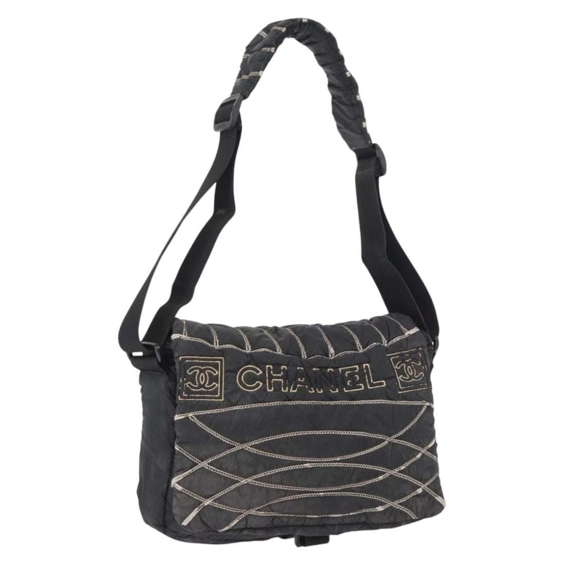 Black Nylon Shoulder Bag by CHANEL with CC Logo: Black Nylon Shoulder Bag by CHANEL with CC Logo This CHANEL shoulder bag is crafted from black nylon and features the iconic CC logo. Made in Italy, the bag offers a practical design with an adjustabl