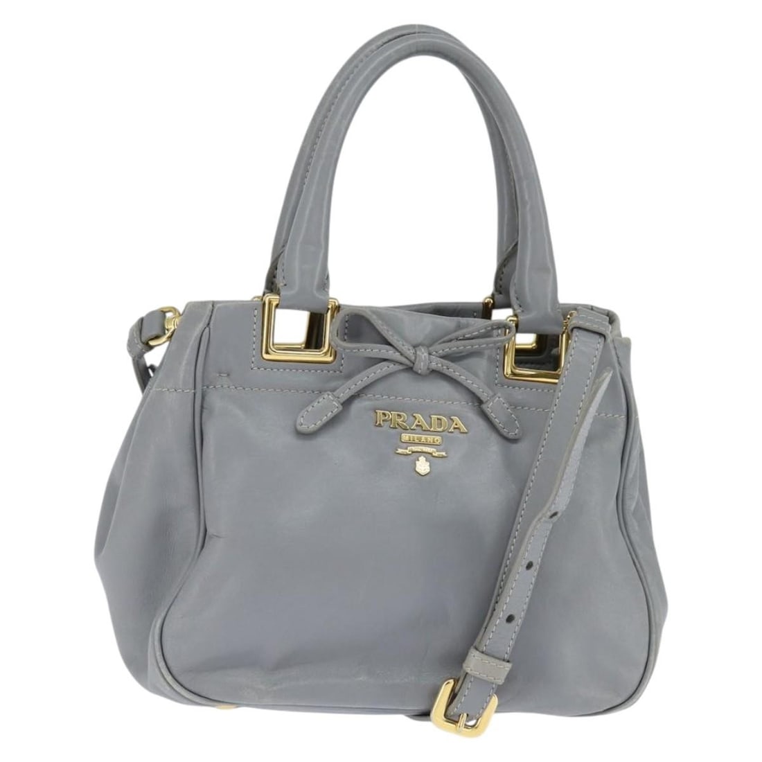 PRADA Leather Hand Bag Gray Gold 2 Way Made in Italy: PRADA Leather Hand Bag Gray Gold 2 Way Made in Italy This PRADA hand bag is a stylish accessory crafted in Italy from high-quality leather. The elegant gray and gold color combination adds a touch of