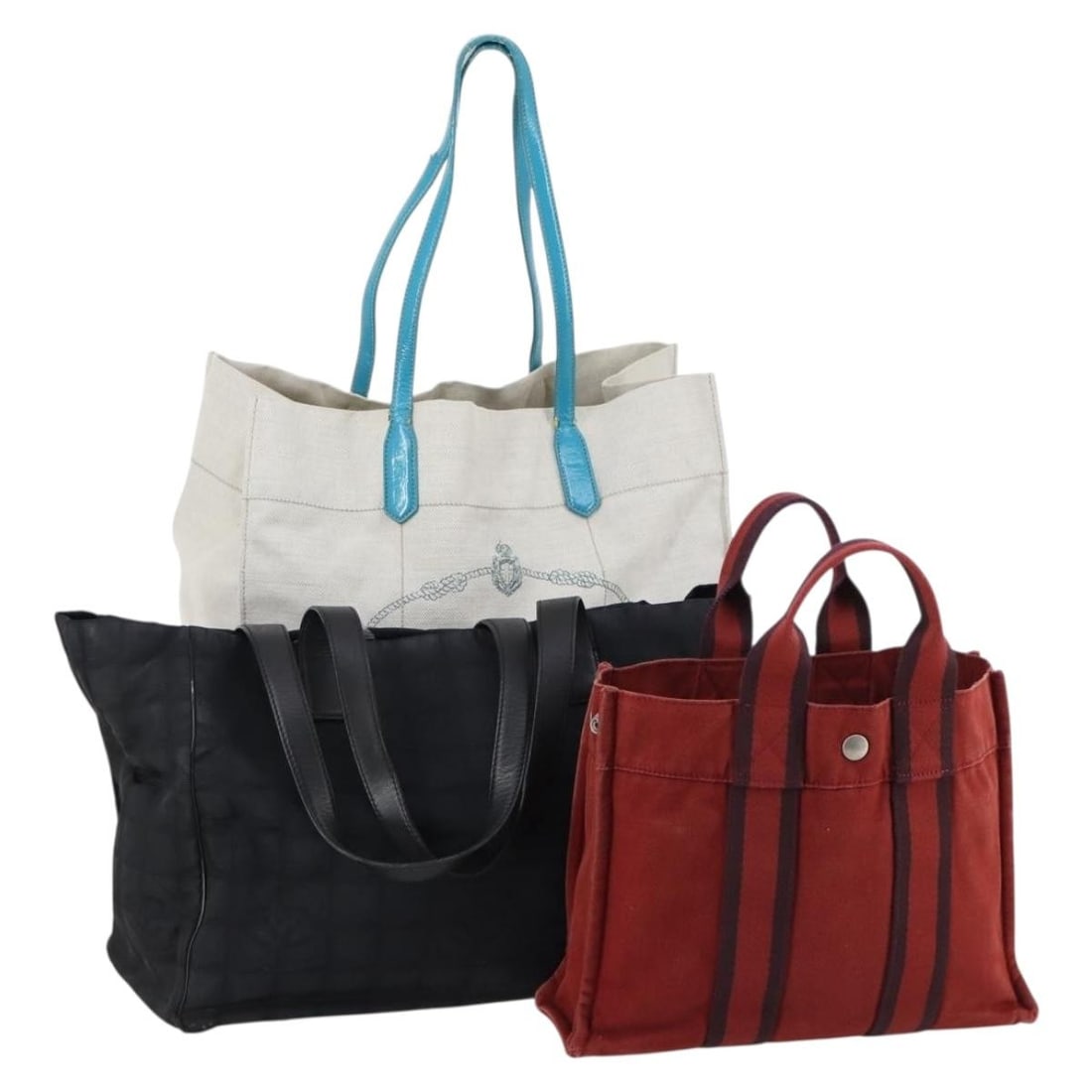 PRADA Canvas Tote Bag Set of 3 Black Red Gray Authentic: PRADA Canvas Tote Bag Set of 3 Black Red Gray Authentic This authentic PRADA tote bag set features a striking combination of black, red, and gray canvas. Designed for versatility, the tote bag showcas