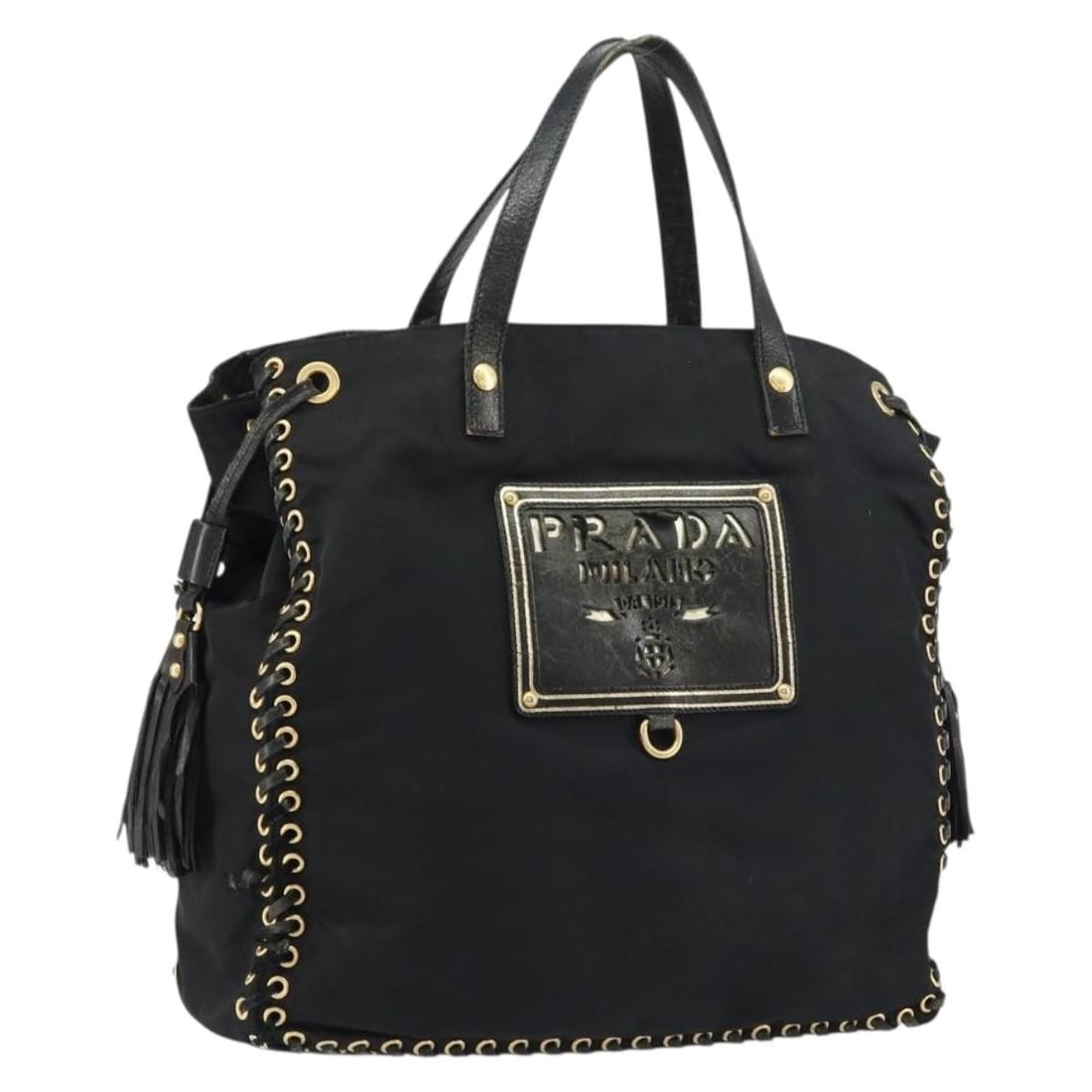 Black and Gold Nylon Tote by PRADA Italy: Black and Gold Nylon Tote by PRADA Italy This is a PRADA tote bag crafted from black nylon with gold-toned accents. Made in Italy, the bag features dual handles and a spacious interior, suitable for e