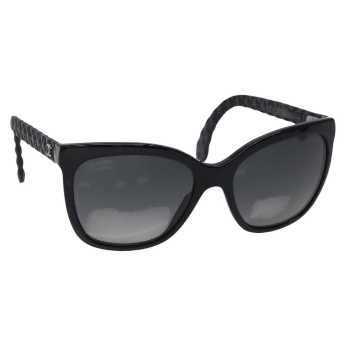 Black Plastic CHANEL Sunglasses with CC Logo and Case: Black Plastic CHANEL Sunglasses with CC Logo and Case These CHANEL sunglasses feature a black plastic frame and the iconic CC logo. Made in Italy, they come with a sunglass case. Please note the sungl