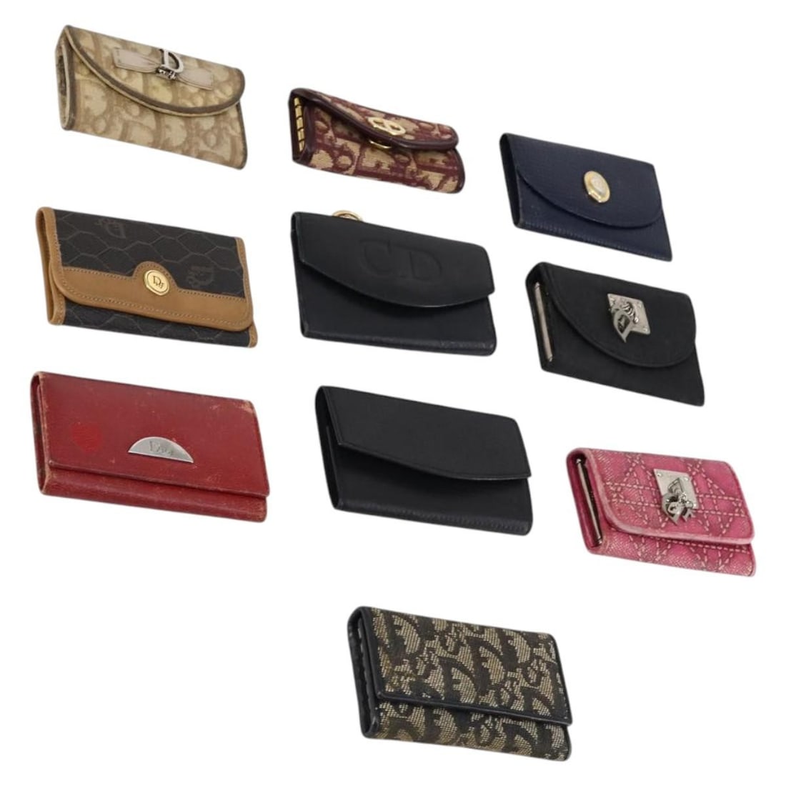 Christian Dior Trotter Canvas Key Case Set of 10 Beige Auth: Christian Dior Trotter Canvas Key Case Set of 10 Beige Auth This Christian Dior Trotter Canvas Key Case is crafted from a blend of leather and Trotter canvas, featuring a stylish beige, black, and red