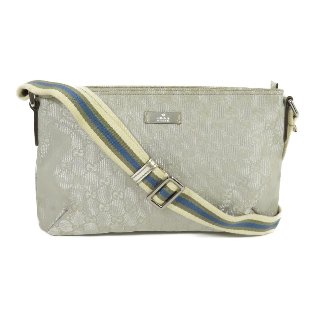 Gucci GG Canvas Shoulder Bag Silver Tone Hardware Italy: Gucci GG Canvas Shoulder Bag Silver Tone Hardware Italy This GUCCI GG Shoulder Bag is a stylish accessory crafted from durable canvas with a sophisticated silver exterior. Measuring 11.4 inches in len