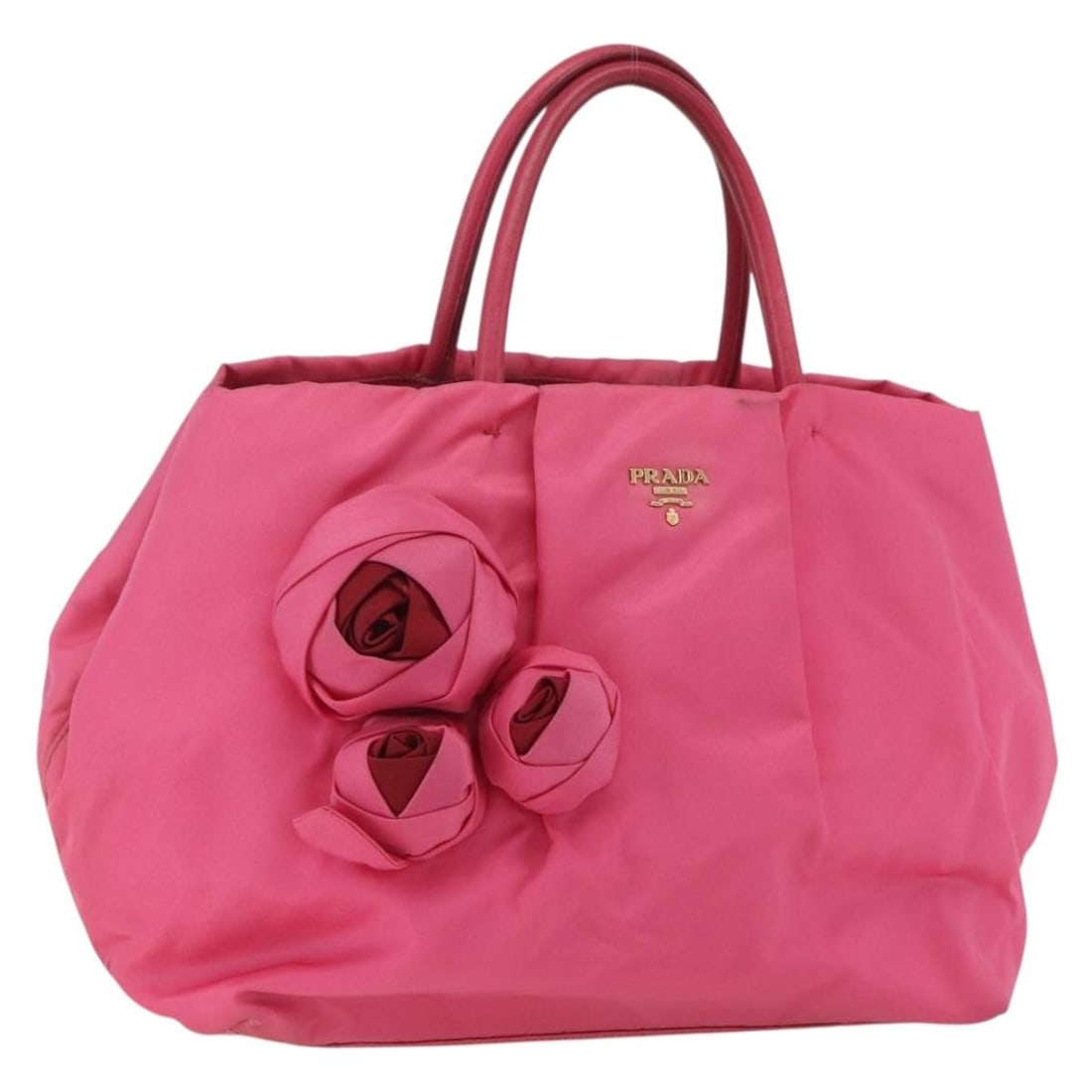 Prada Pink Nylon Handbag with Gold Accents Made in Italy: Prada Pink Nylon Handbag with Gold Accents Made in Italy This PRADA handbag features a pink and gold nylon exterior, crafted in Italy. The bag has a structured design with approximate dimensions of 11