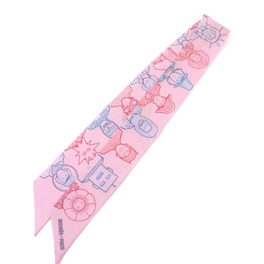 Silk Twilly Scarf by Hermes in Pink Red Blue Tones: Silk Twilly Scarf by Hermes in Pink Red Blue Tones This Hermes Twilly scarf is crafted from silk and features a vibrant pink, red, and blue color palette. Made in France, it offers a stylish accent to