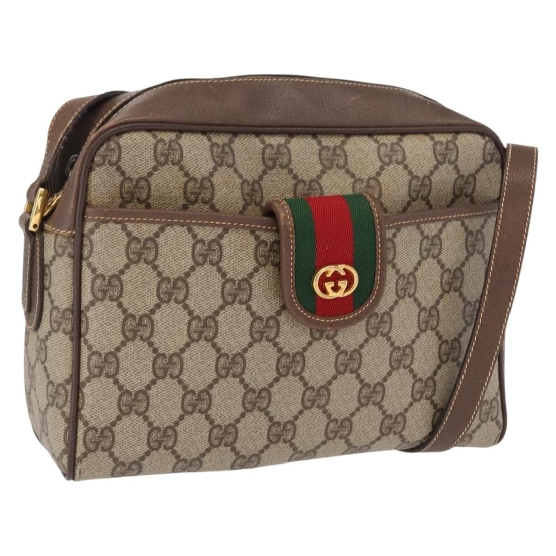 Beige GG Supreme PVC Shoulder Bag by Gucci Italy Gold Accent: Beige GG Supreme PVC Shoulder Bag by Gucci Italy Gold Accent This is a Gucci GG Supreme shoulder bag crafted from beige and gold PVC leather with GG canvas accents. The bag features a spacious main co