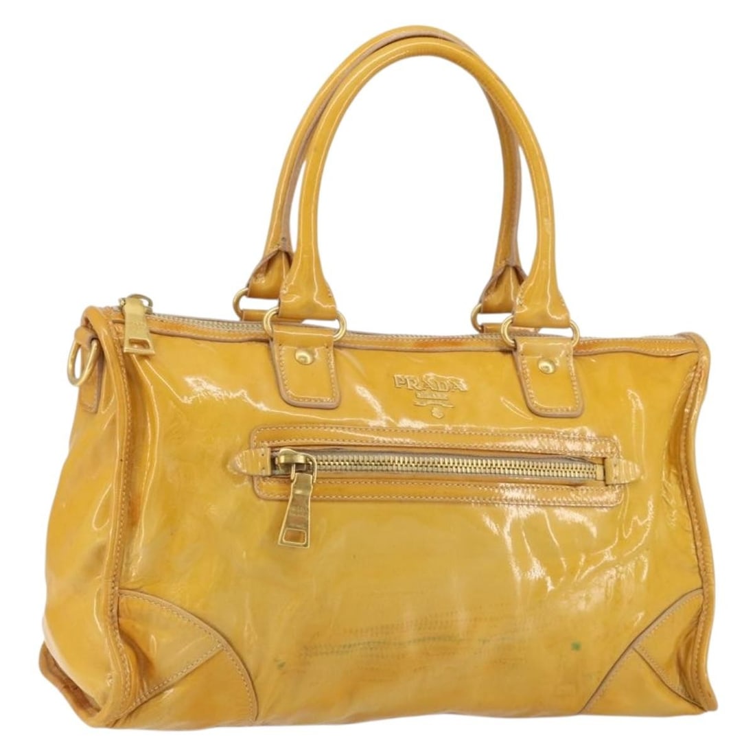 PRADA Yellow Gold Patent Leather Hand Bag with Guarantee Card: PRADA Yellow Gold Patent Leather Hand Bag with Guarantee Card This PRADA Hand Bag is a stunning blend of style and luxury, crafted from premium patent leather with an eye-catching yellow and gold exte