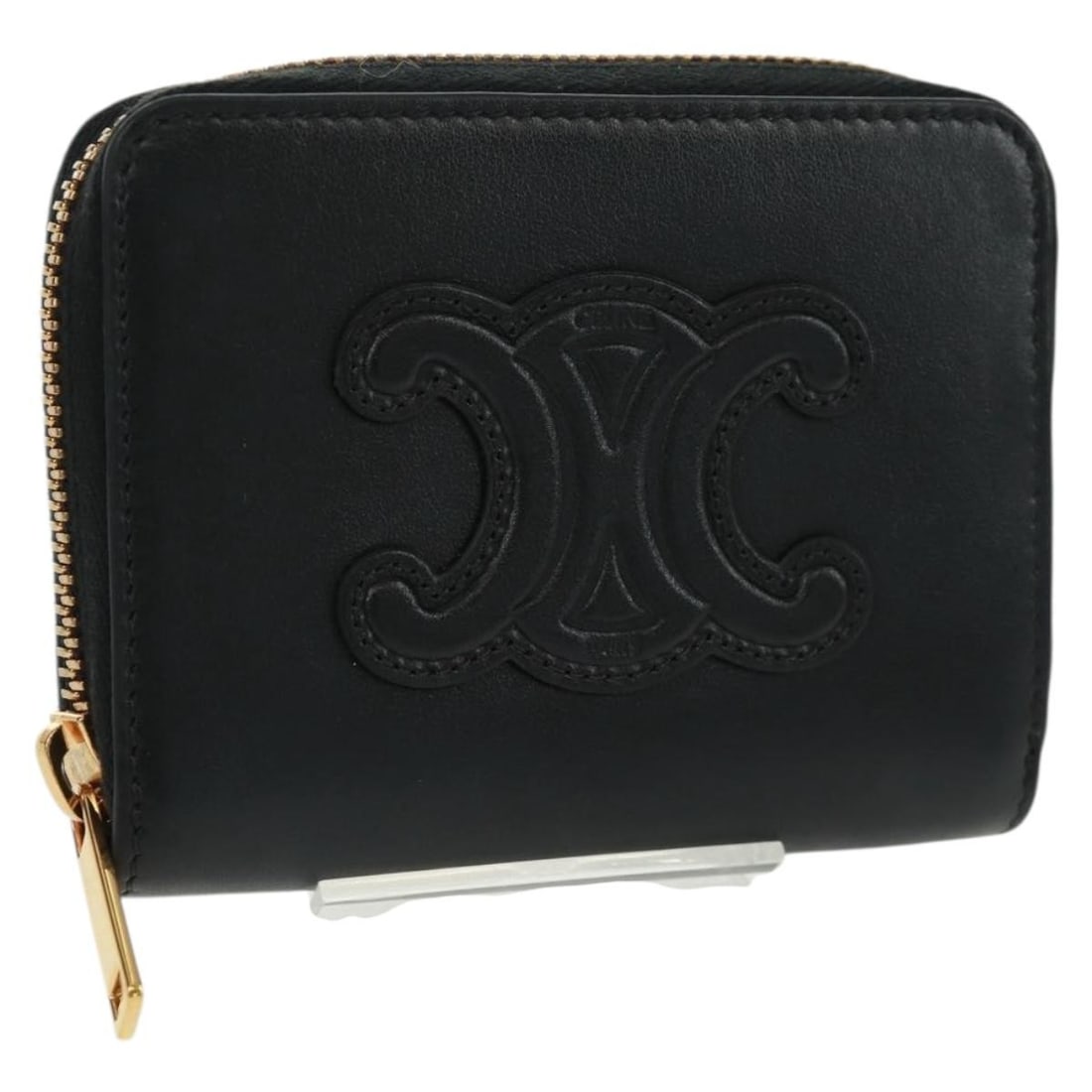 Black Leather Triomphe Wallet by CELINE Made in Italy: Black Leather Triomphe Wallet by CELINE Made in Italy This CELINE Triomphe wallet features a classic black leather exterior and a compact, functional design. Crafted in Italy, it offers a sleek and ti