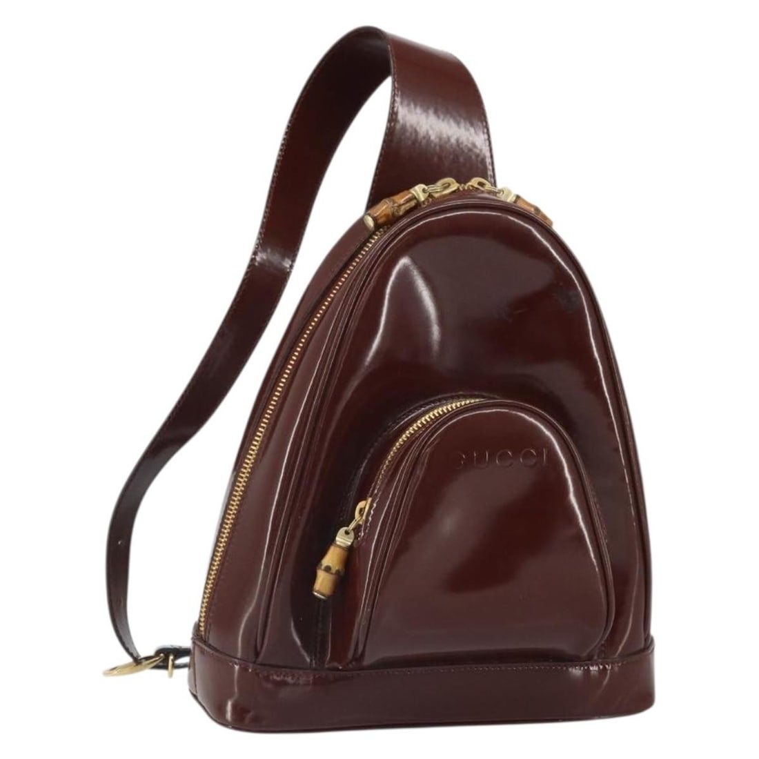 Gucci Brown Patent Leather Bamboo Backpack Model 003 3444 0127: Gucci Brown Patent Leather Bamboo Backpack Model 003 3444 0127 This is a Gucci Bamboo Backpack crafted from brown and gold patent leather. The bag features a compact design with a bamboo top handle an
