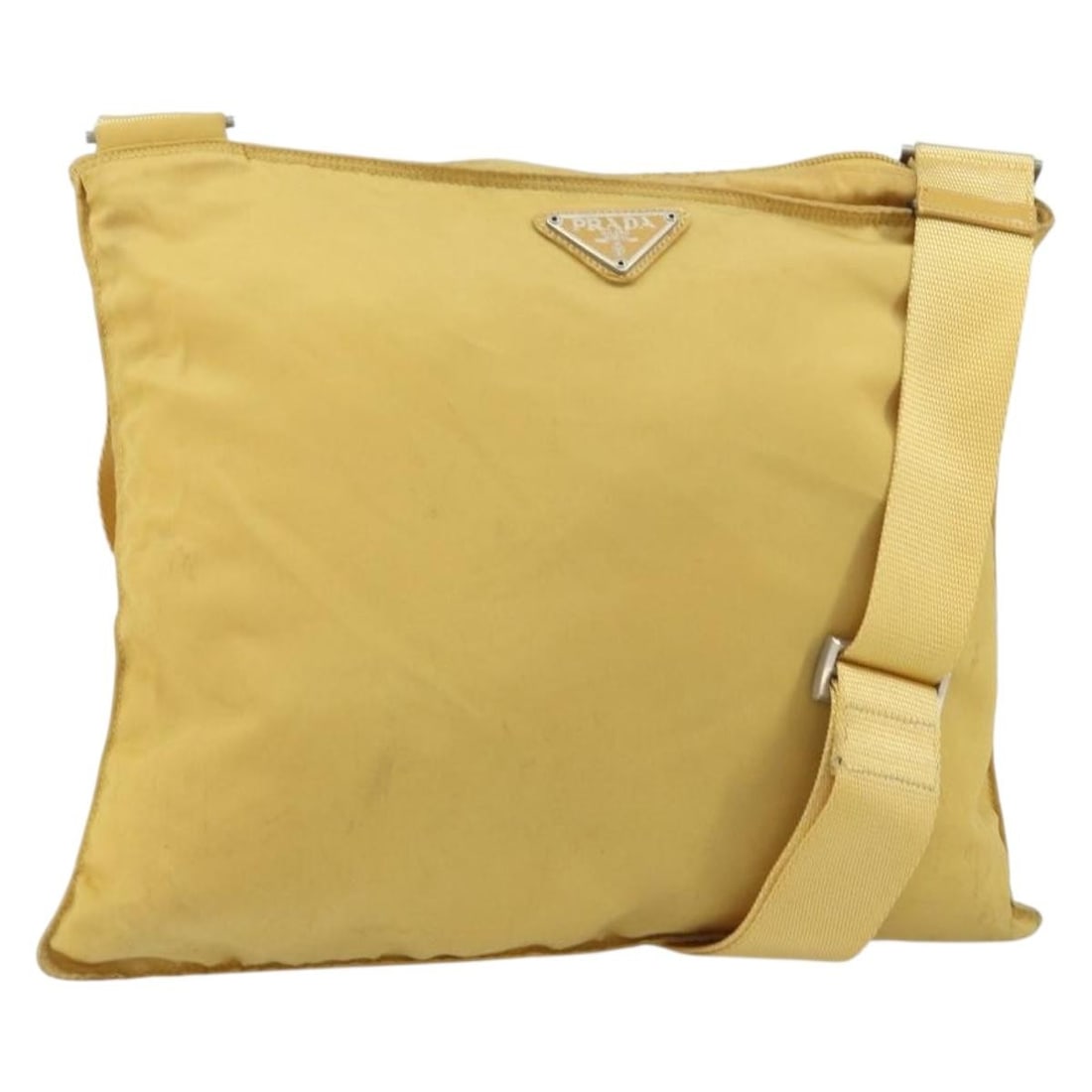 Yellow Nylon Prada Shoulder Bag With Silver Accents Italy: Yellow Nylon Prada Shoulder Bag With Silver Accents Italy This PRADA shoulder bag features a yellow and silver nylon exterior with silver-tone hardware. Made in Italy, the bag has an adjustable