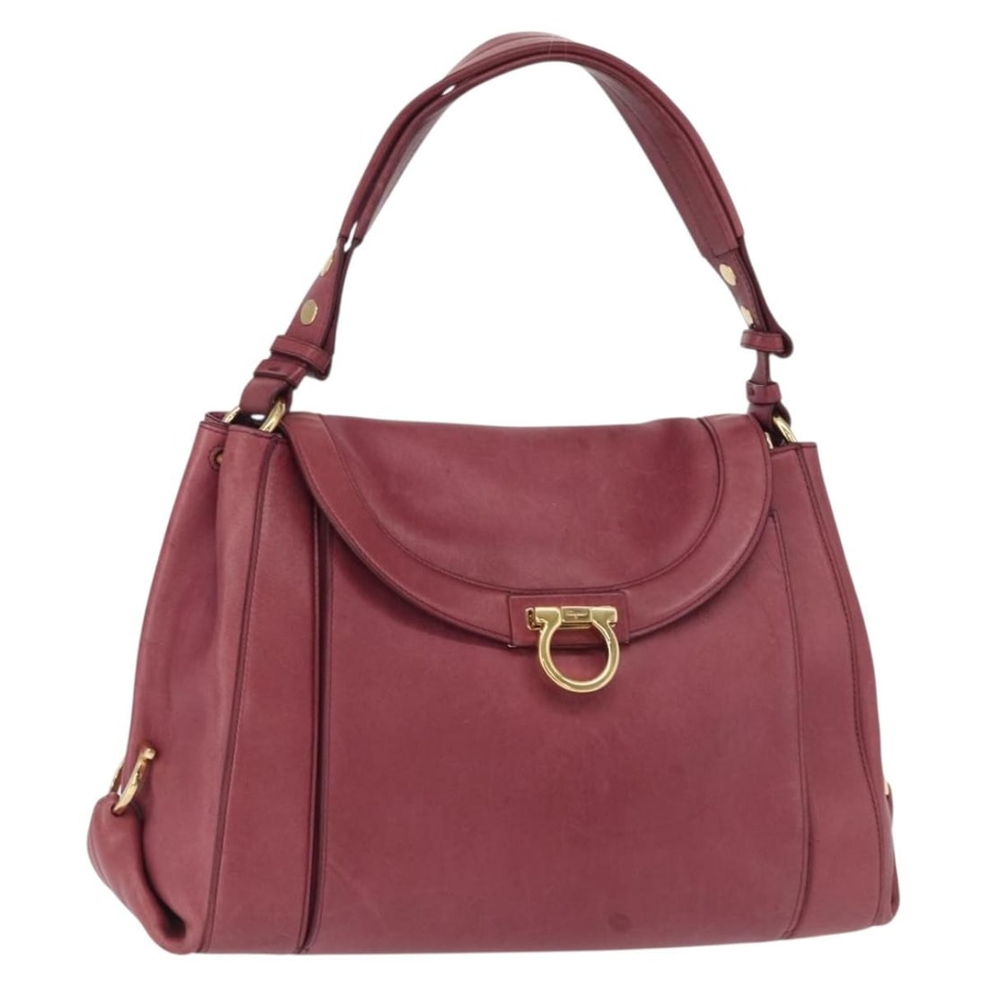 Pink Leather Gancini Shoulder Bag by Salvatore Ferragamo: Pink Leather Gancini Shoulder Bag by Salvatore Ferragamo This Salvatore Ferragamo Gancini shoulder bag features pink leather with gold-tone accents. The bag has a structured silhouette with a top