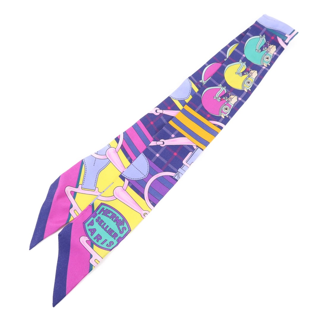 Silk Multicolor Twilly Scarf from Hermes France: Silk Multicolor Twilly Scarf from Hermes France This Hermes Twilly scarf is crafted from luxurious silk and features a vibrant multicolor design. Made in France, it is a versatile accessory with a reg