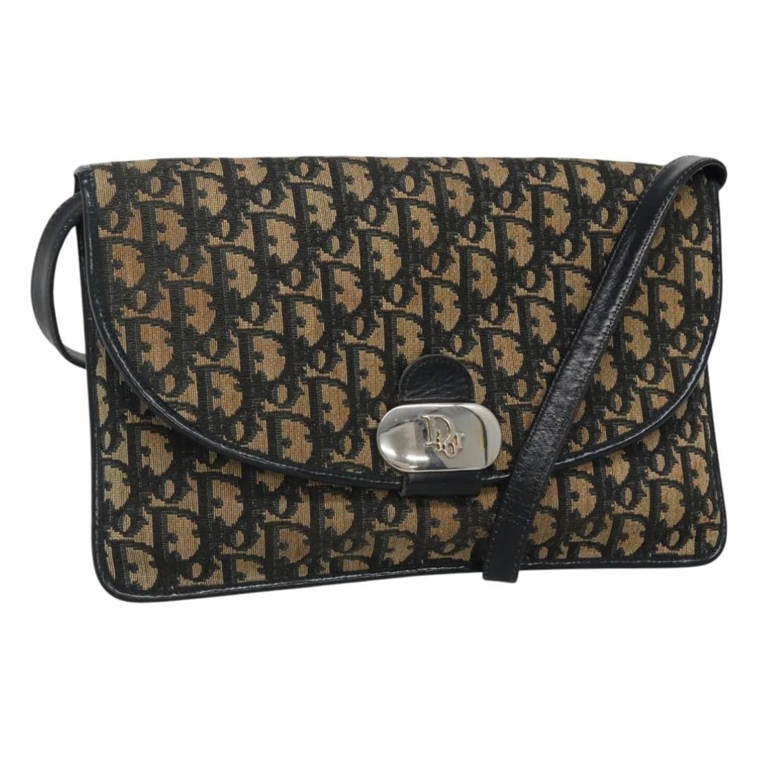 Christian Dior Navy Trotter Canvas Shoulder Bag Made in France: Christian Dior Navy Trotter Canvas Shoulder Bag Made in France This Christian Dior Trotter Canvas Shoulder Bag features a chic navy exterior crafted from durable canvas. With dimensions of approximate