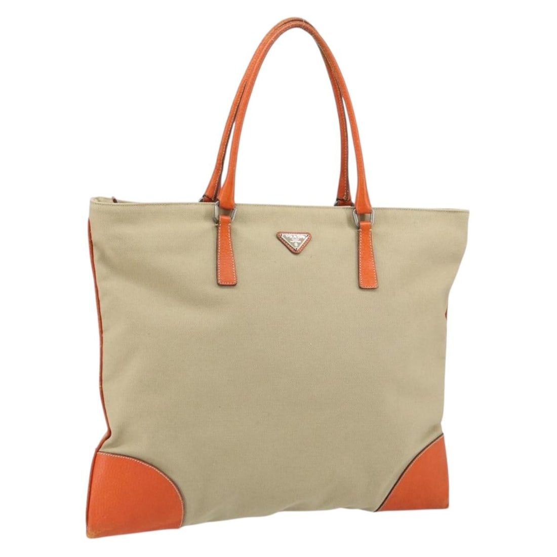 Beige and Silver Canvas Prada Tote Bag Italy: Beige and Silver Canvas Prada Tote Bag Italy This PRADA handbag features a beige and silver canvas exterior, crafted in Italy. The bag shows signs of heavy use, including rubbing, stains, loss of shap