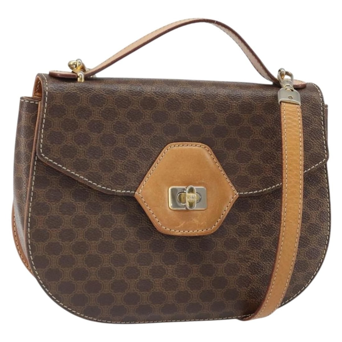 CELINE 2way Brown Macadam Canvas Shoulder Bag with PVC Leather: CELINE 2way Brown Macadam Canvas Shoulder Bag with PVC Leather This CELINE Macadam Canvas Shoulder Bag features a brown and gold color scheme crafted from PVC leather and Macadam canvas. Designed in I