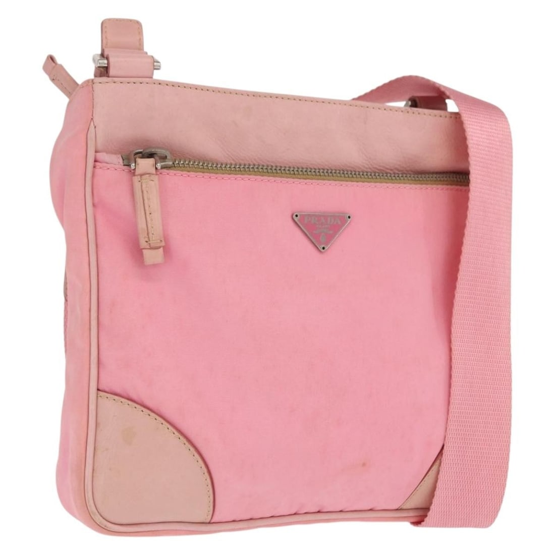 Pink Nylon and Leather Prada Shoulder Bag with Silver Tone Details: Pink Nylon and Leather Prada Shoulder Bag with Silver Tone Details This PRADA shoulder bag features a stylish pink and silver nylon exterior with leather accents. Designed for everyday use, the bag of
