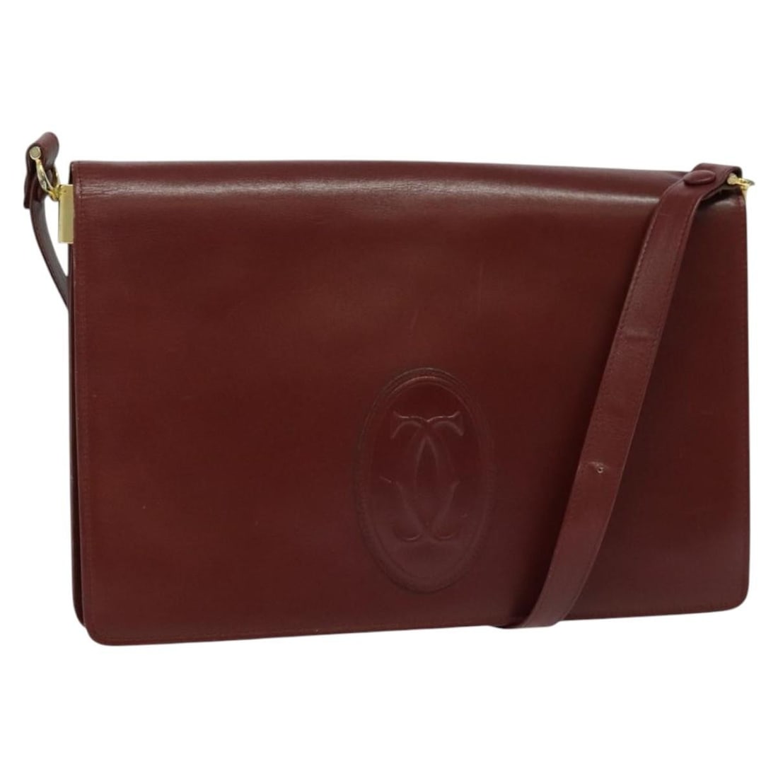 CARTIER Must Line Bordeaux Gold Leather Shoulder Bag: CARTIER Must Line Bordeaux Gold Leather Shoulder Bag This exquisite CARTIER Must Line Shoulder Bag is crafted from luxurious leather in a rich Bordeaux and gold color combination. Designed for eleganc