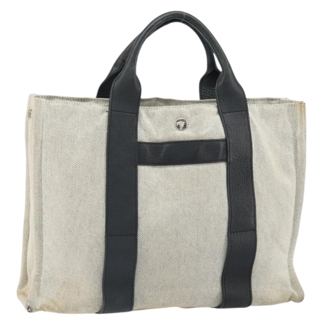 Hermes Arne MM Canvas Tote in Gray and Silver: Hermes Arne MM Canvas Tote in Gray and Silver This Hermes Sac Arne MM hand bag features a gray and silver canvas exterior. It is designed with a structured silhouette and provides ample space for esse