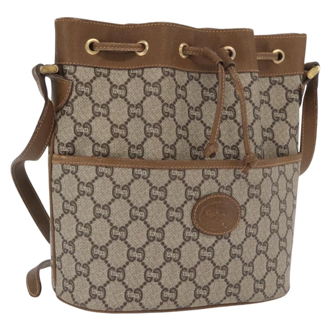 Beige Gold PVC Supreme Shoulder Bag by Gucci GG Plus Collection: Beige Gold PVC Supreme Shoulder Bag by Gucci GG Plus Collection This Gucci GG Plus Supreme shoulder bag features a beige and gold color scheme with PVC leather and GG canvas exterior. The bag is desig