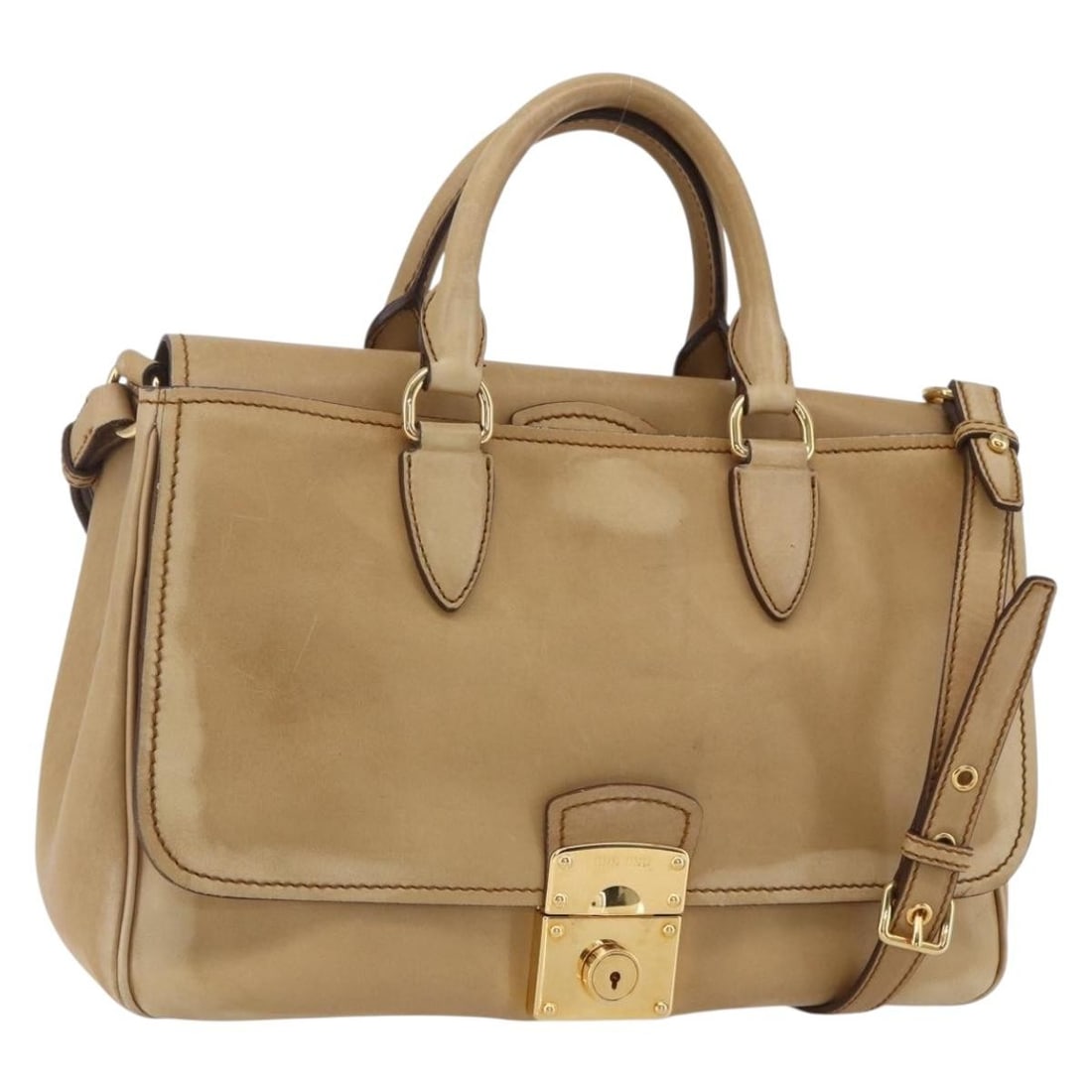 Miu Miu Beige Gold Leather 2way Hand Bag Authentic 153125: Miu Miu Beige Gold Leather 2way Hand Bag Authentic 153125 This Miu Miu Hand Bag is crafted from luxurious leather in a chic beige and gold color scheme. Designed for versatility, it features a spaciou