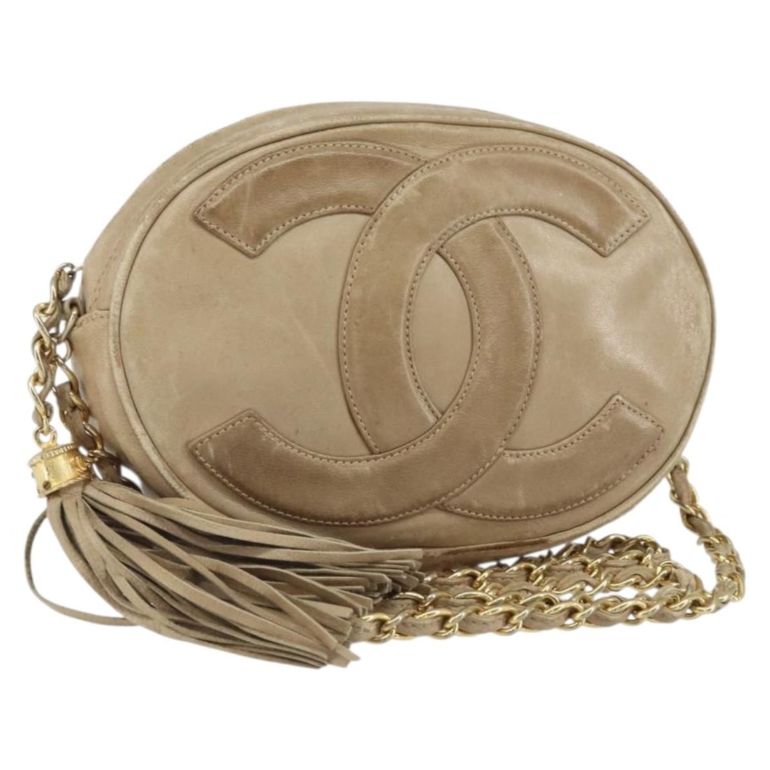 Beige Lambskin Chain Shoulder Bag by CHANEL with Gold CC Logo: Beige Lambskin Chain Shoulder Bag by CHANEL with Gold CC Logo This CHANEL chain shoulder bag is crafted from beige lambskin leather and features gold-tone accents and a signature CC detail. The bag is