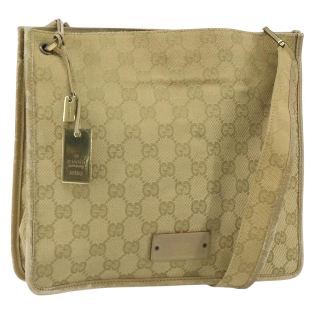 Beige Gold GG Canvas 91762 Shoulder Bag by Gucci Italy: Beige Gold GG Canvas 91762 Shoulder Bag by Gucci Italy This GUCCI GG Canvas Shoulder Bag features a beige and gold color scheme with the signature GG canvas material. Made in Italy, it includes an adj