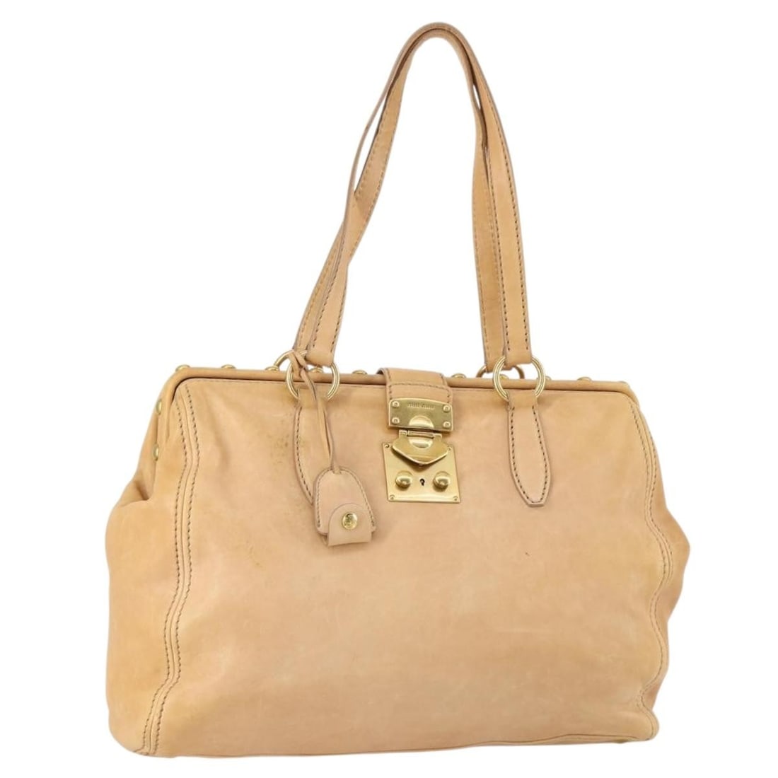 Miu Miu Beige Gold Leather Tote Bag with Accessories: Miu Miu Beige Gold Leather Tote Bag with Accessories This Miu Miu Tote Bag is a sophisticated accessory crafted from high-quality leather in a chic beige and gold color scheme. Designed in Italy,