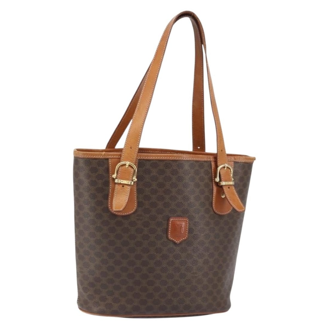 Celine Macadam Brown PVC Canvas Tote Bag with Gold Accents: Celine Macadam Brown PVC Canvas Tote Bag with Gold Accents This CELINE Macadam tote bag features a classic brown and gold color scheme with a PVC leather and Macadam canvas exterior. The bag is made i