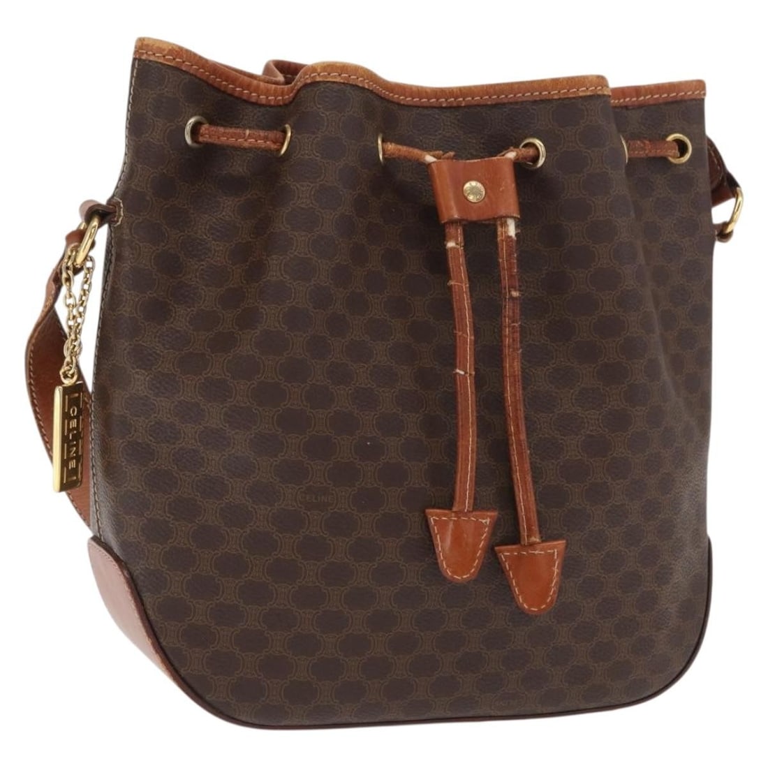 Celine Macadam Brown and Gold PVC Leather Shoulder Bag: Celine Macadam Brown and Gold PVC Leather Shoulder Bag This CELINE shoulder bag features the iconic Macadam canvas with PVC leather accents in brown and gold tones. Made in Italy, it offers a spacious