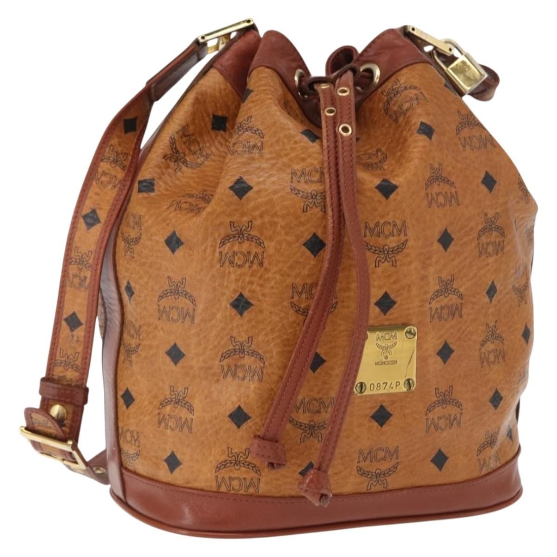 MCM Brown Gold Logogram PVC Leather Shoulder Bag with Dust Bag and Padlock: MCM Brown Gold Logogram PVC Leather Shoulder Bag with Dust Bag and Padlock This MCM Logogram Vicetos shoulder bag features a brown and gold PVC leather exterior with a distinctive logo design. The bag