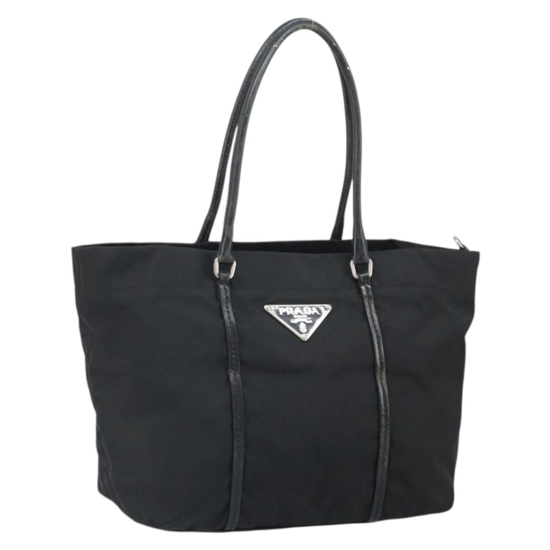 Black Nylon Tote by Prada with Silver Details Made in Italy: Black Nylon Tote by Prada with Silver Details Made in Italy This PRADA tote bag is crafted from black nylon with silver-tone accents. It features dual handles with a drop of approximately 6.7 inches (