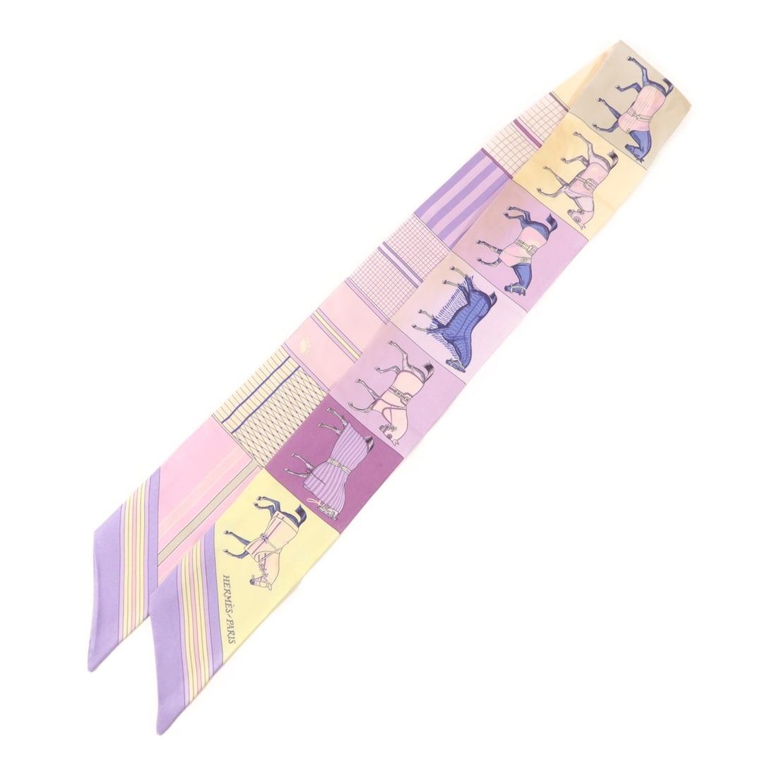 Silk Twilly Scarf by Hermes in Purple and Beige: Silk Twilly Scarf by Hermes in Purple and Beige This Hermes Twilly scarf is crafted from silk in a purple and beige color scheme. It is a regular size and made in France. The scarf is categorized as h