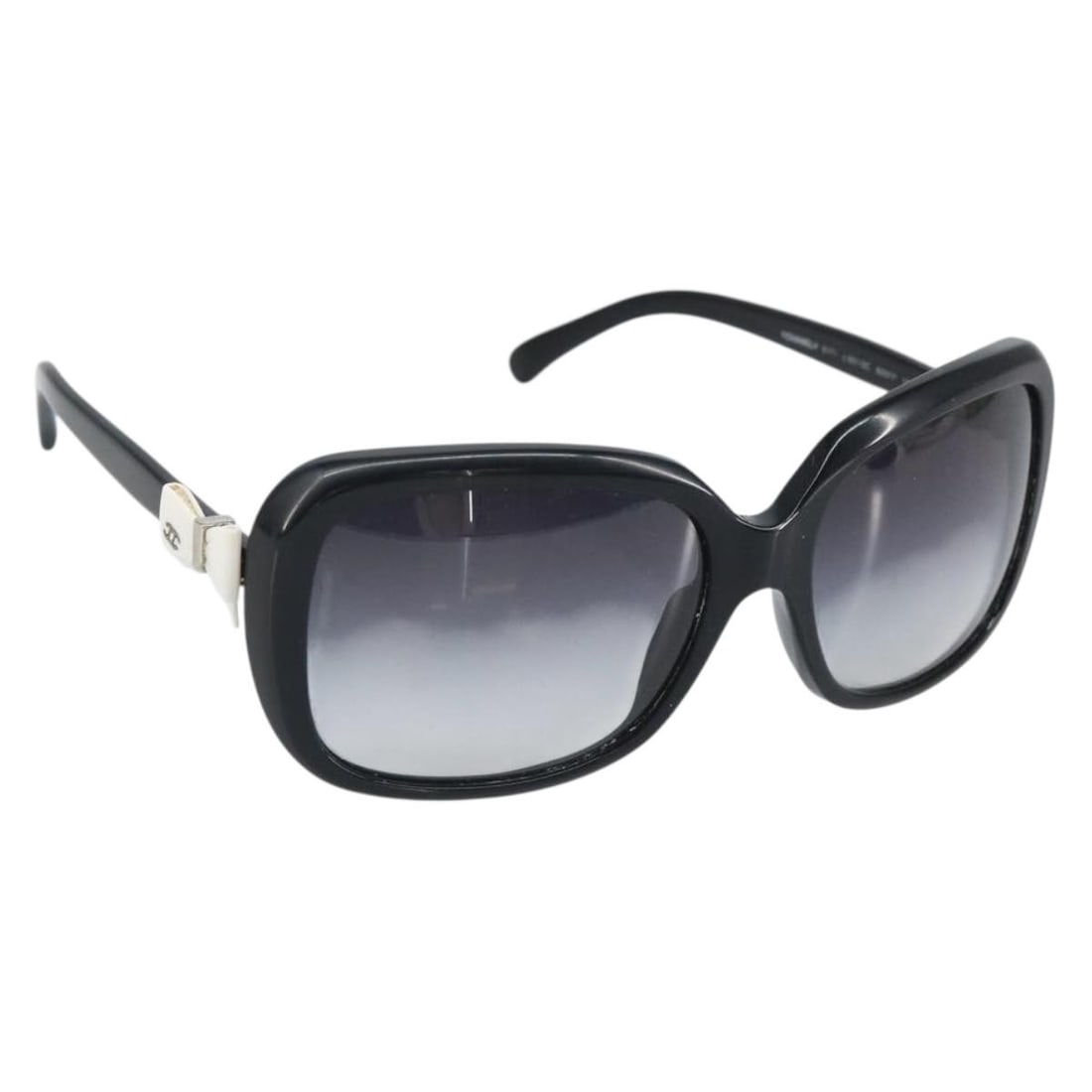 Coco Ribbon Black Plastic Sunglasses by CHANEL with Case: Coco Ribbon Black Plastic Sunglasses by CHANEL with Case These CHANEL Coco Ribbon sunglasses feature a classic black plastic frame with the iconic CC logo. Made in Italy, they come with a sunglass cas