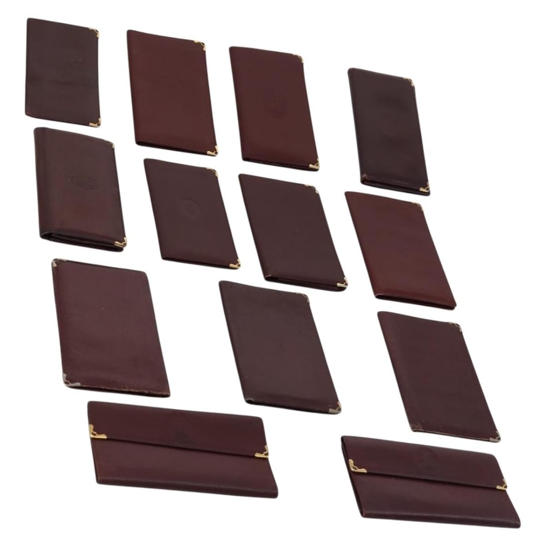 CARTIER Must Line Bordeaux Leather Wallet Set with Guarantee Card: CARTIER Must Line Bordeaux Leather Wallet Set with Guarantee Card This CARTIER Must Line Wallet is crafted from luxurious leather in a rich bordeaux hue, making it a stylish accessory for any occasion